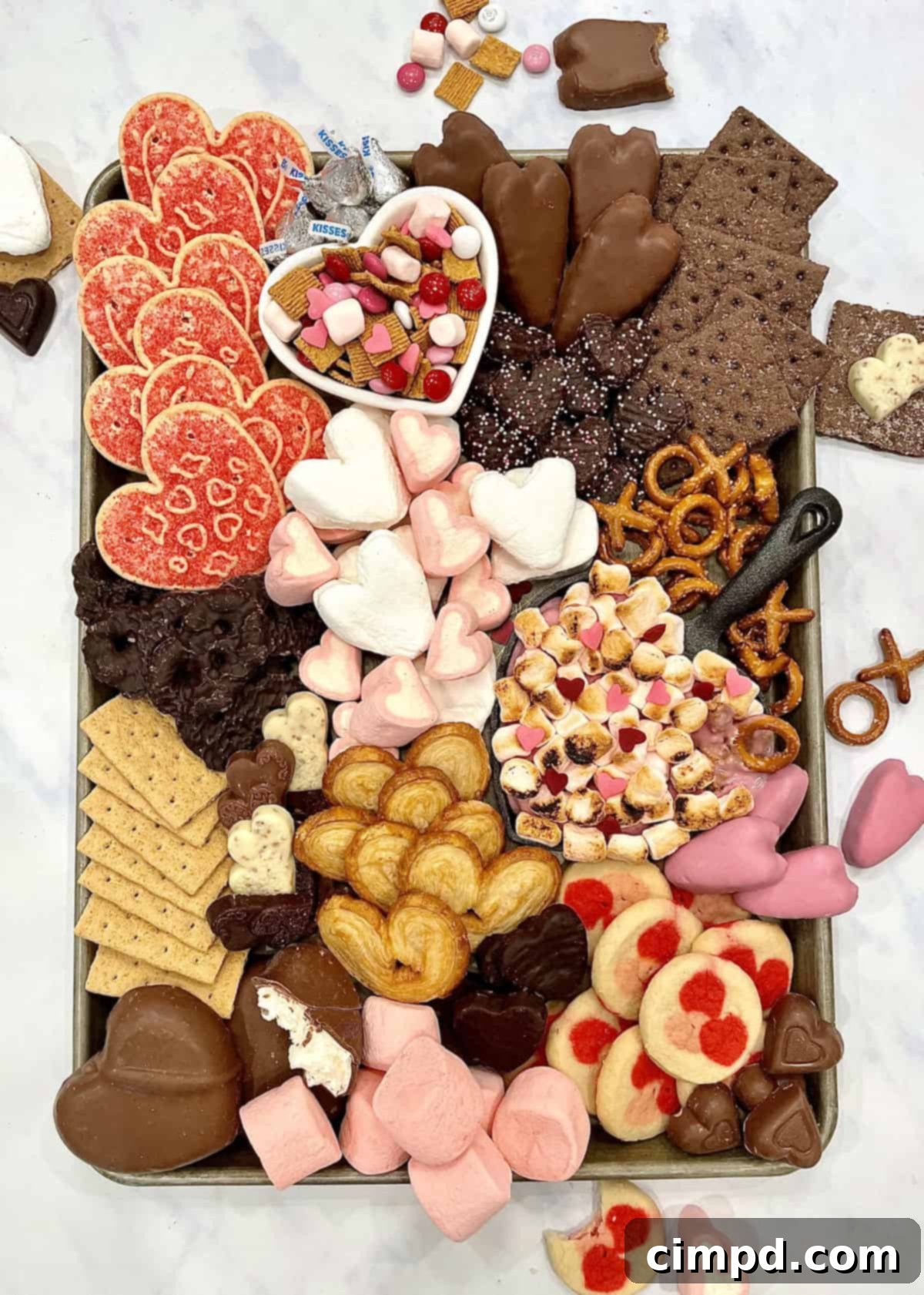 A beautifully arranged Valentine's Day S'mores Tray featuring heart-shaped marshmallows, chocolates, and cookies.