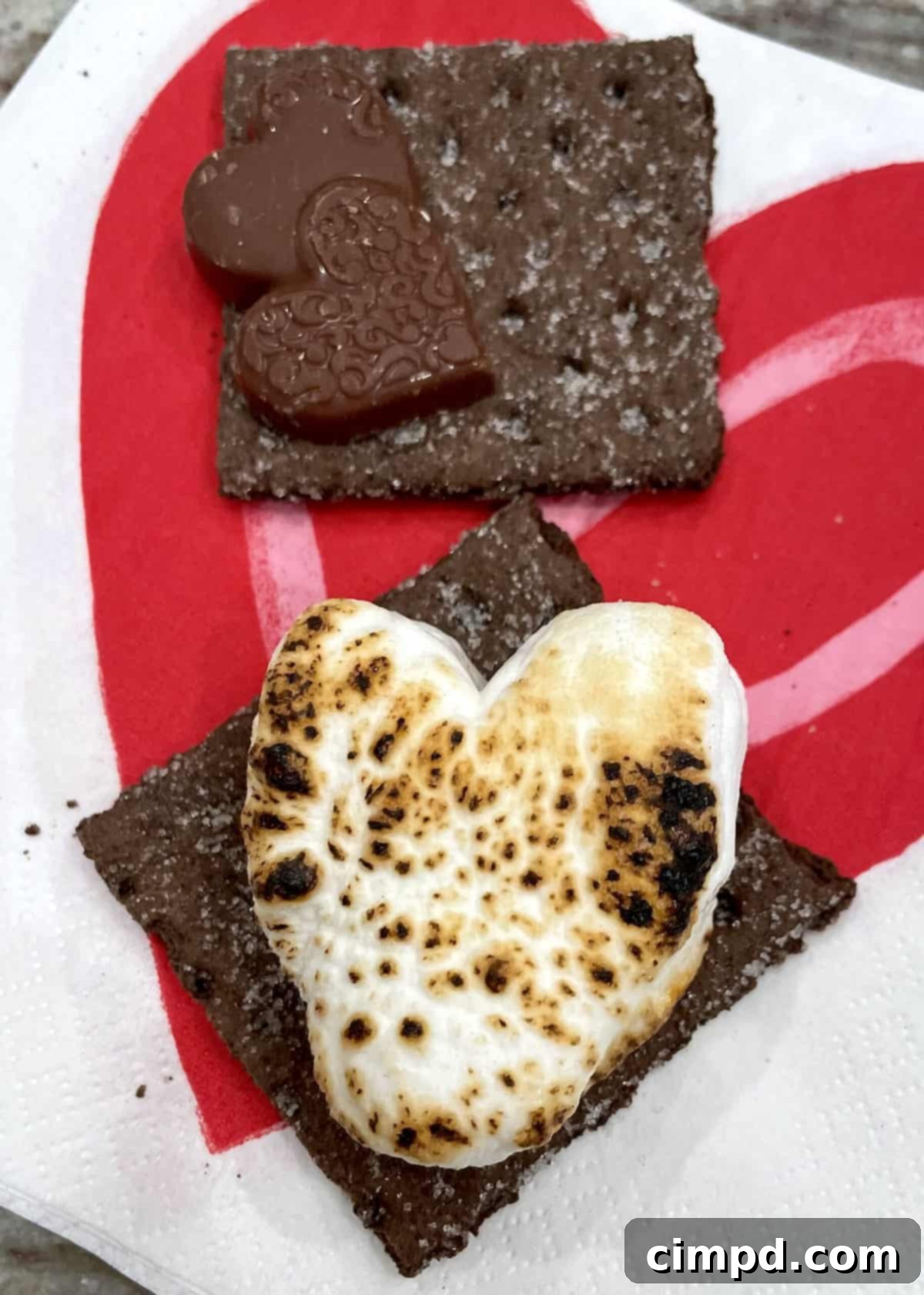 Close-up of heart-shaped treats and s'mores ingredients on a Valentine's Day S'mores Tray.