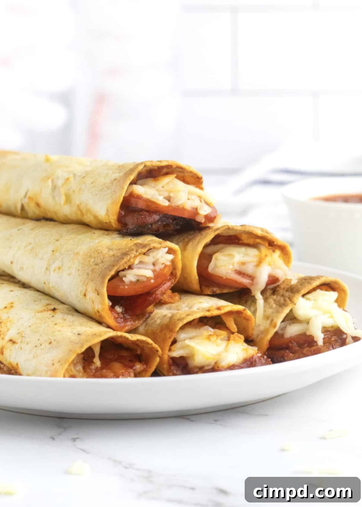 Baked Pizza Taquitos by The BakerMama