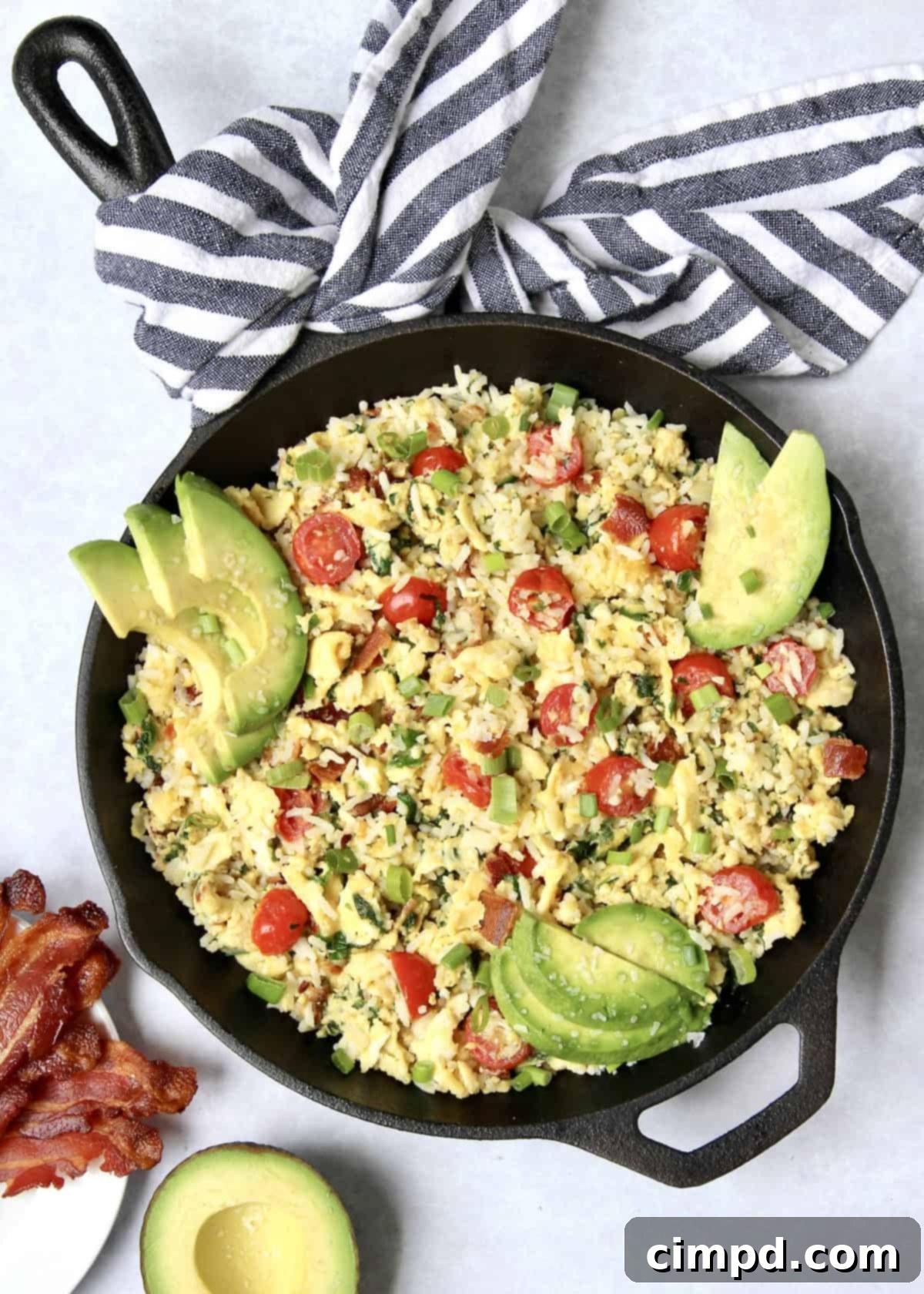 Savory Breakfast Rice Scramble with bacon, eggs, and fresh vegetables.