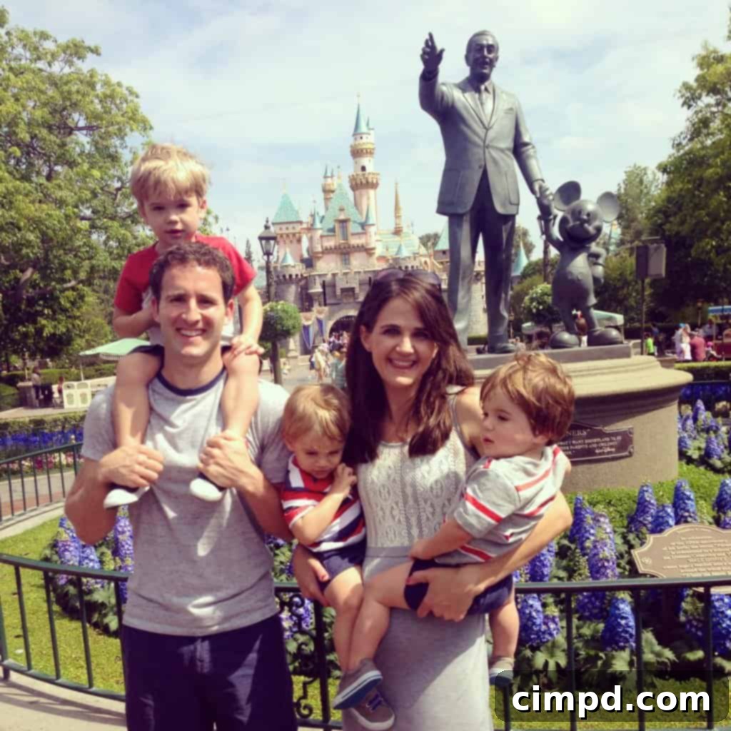 Disneyland with Toddlers - Family photo in front of the castle