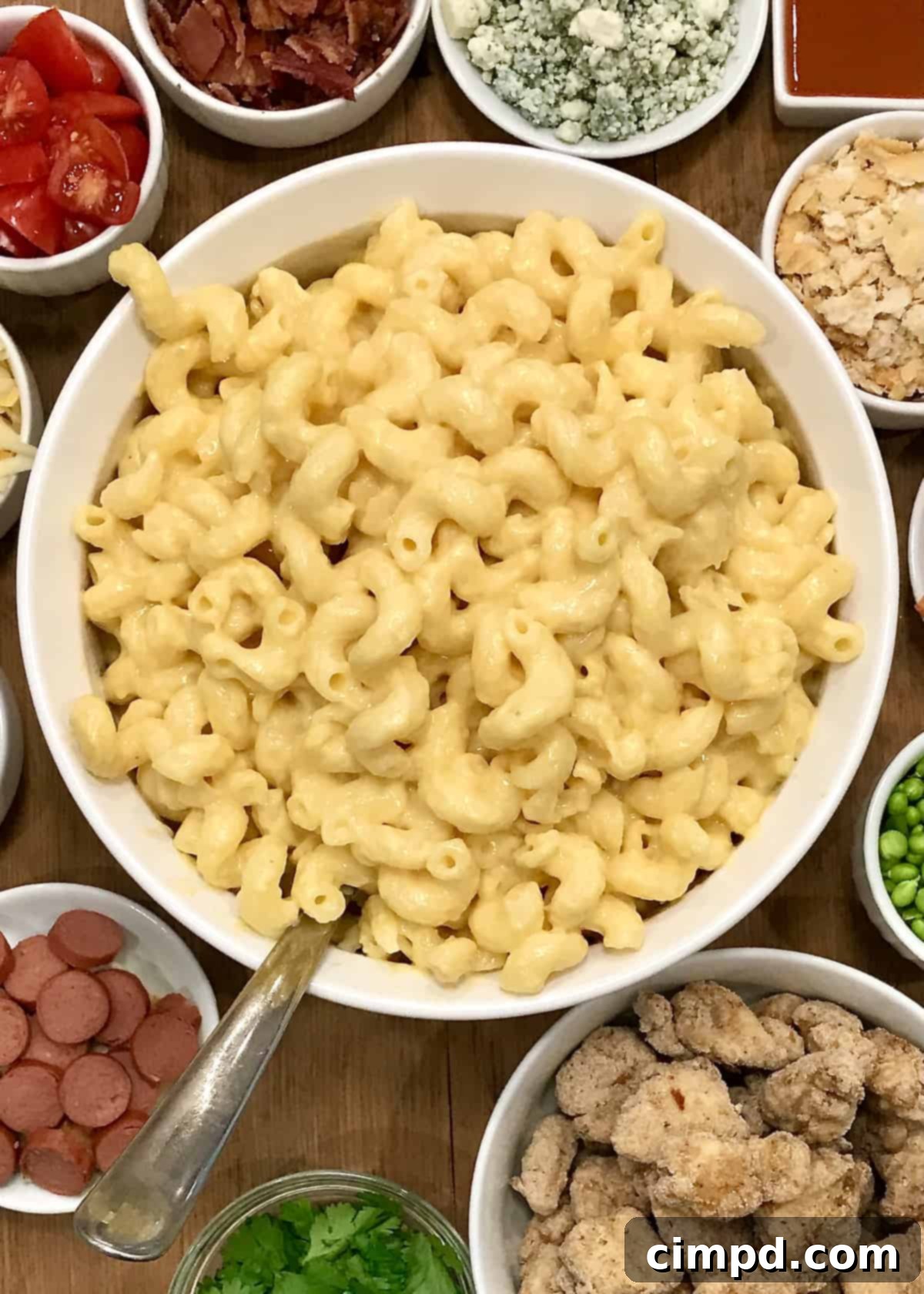 Macaroni and Cheese Charcuterie Board 3 Close-up of a Mac & Cheese Board laden with colorful toppings, ready for personalized creations.