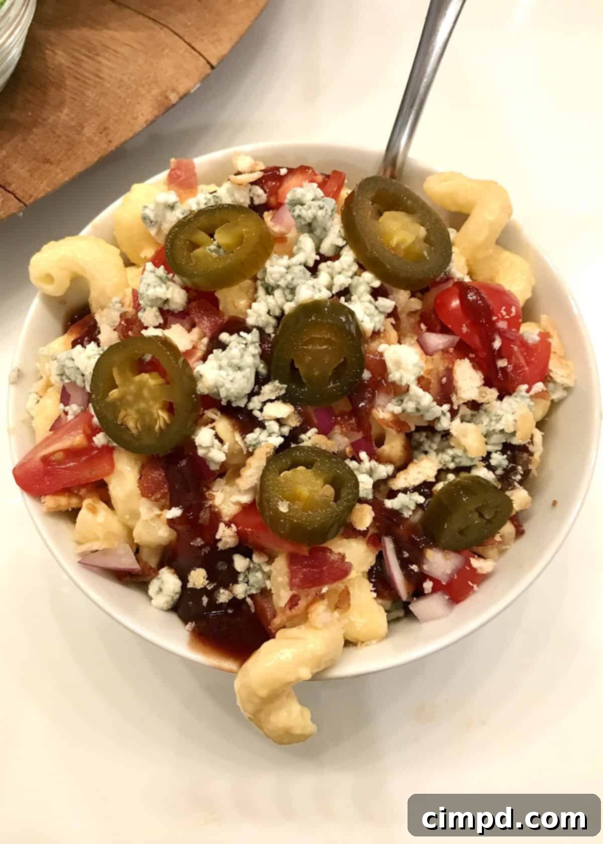 Macaroni and Cheese Charcuterie Board 5 A close-up view of the Mac & Cheese Board, highlighting the central bowl of mac and cheese surrounded by topping options.