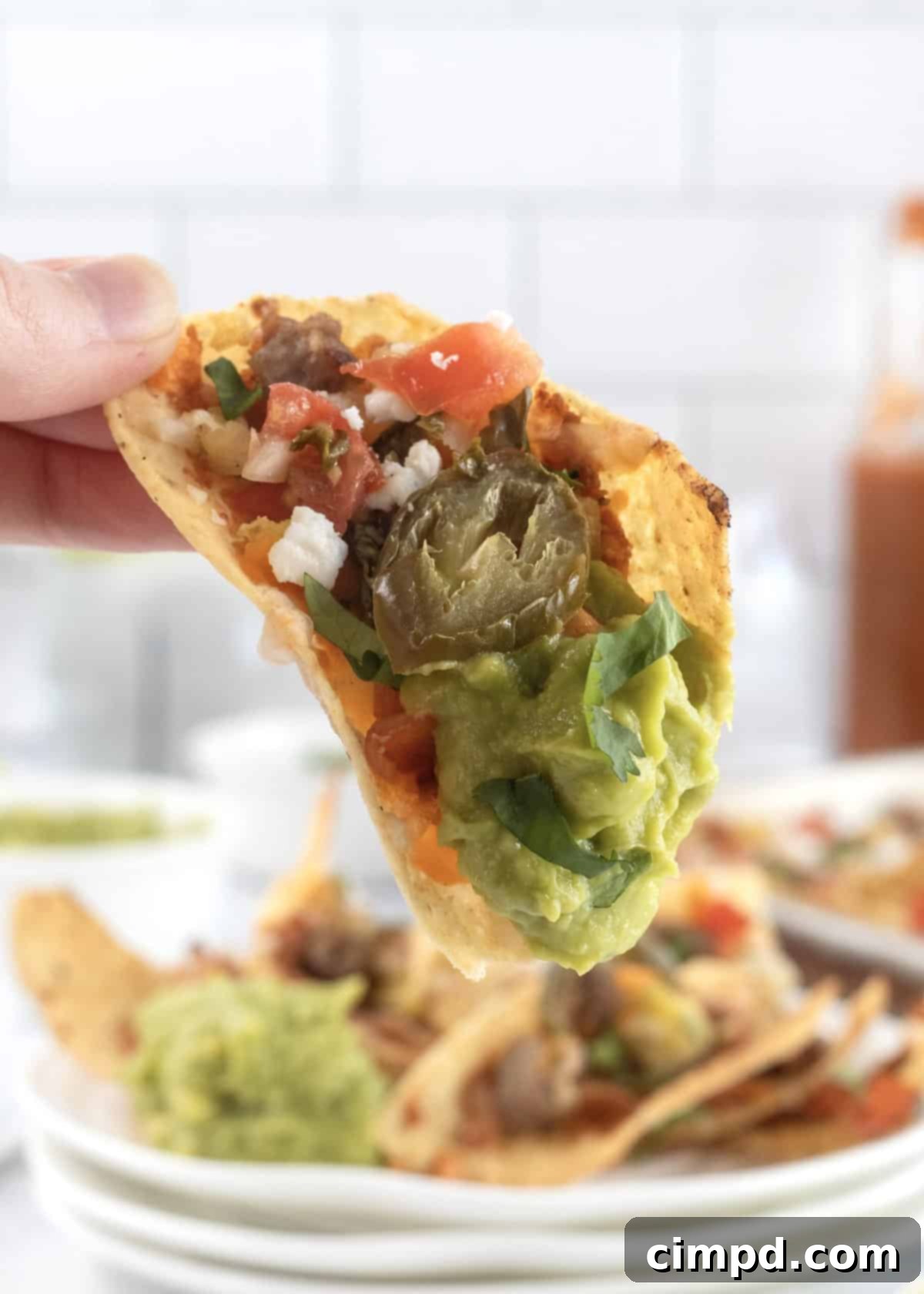 Rise and Shine Nachos 4 A close-up shot of breakfast nachos, showing the generous toppings and melted cheese before serving.