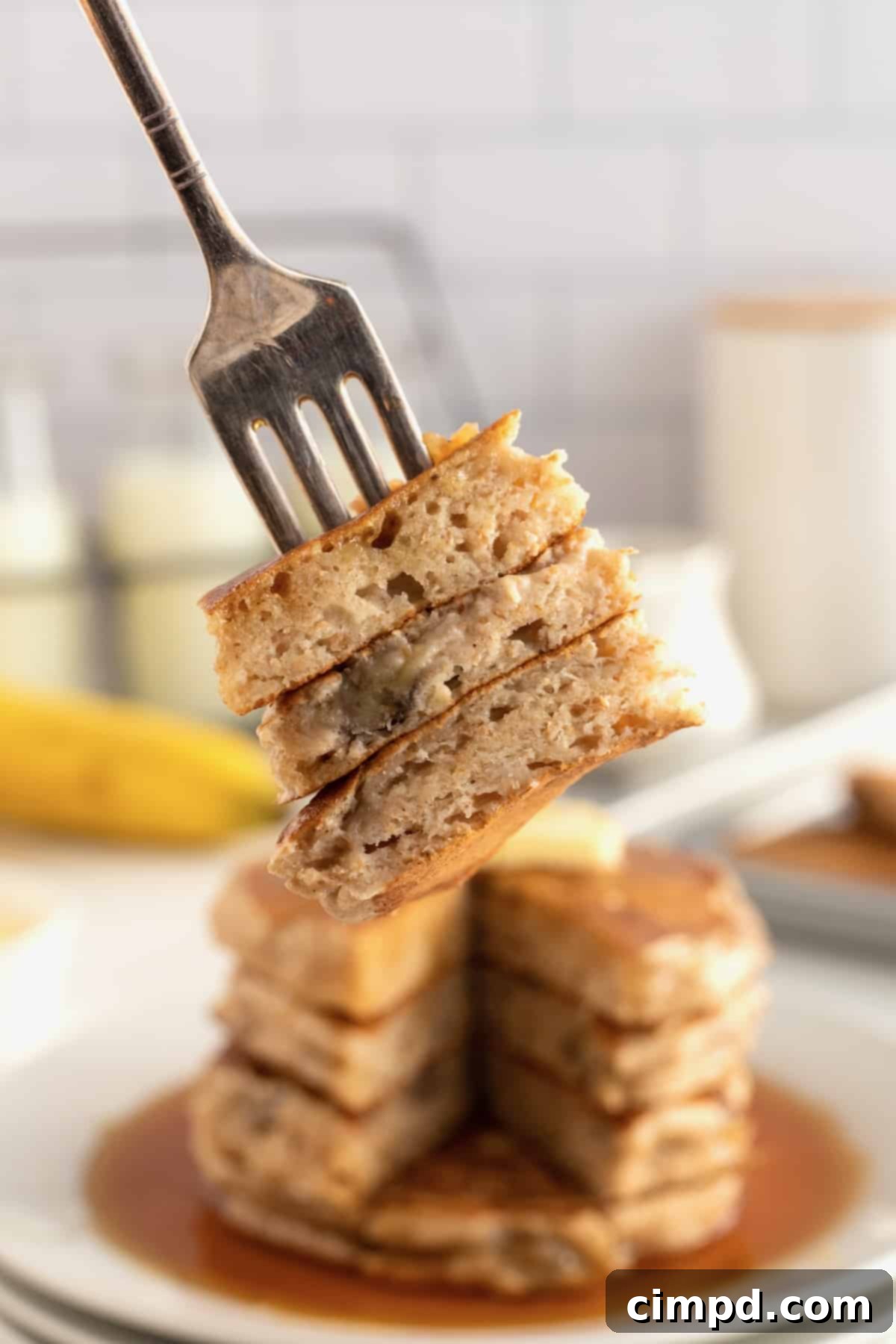Another view of Whole Wheat Banana Pancakes on a plate.