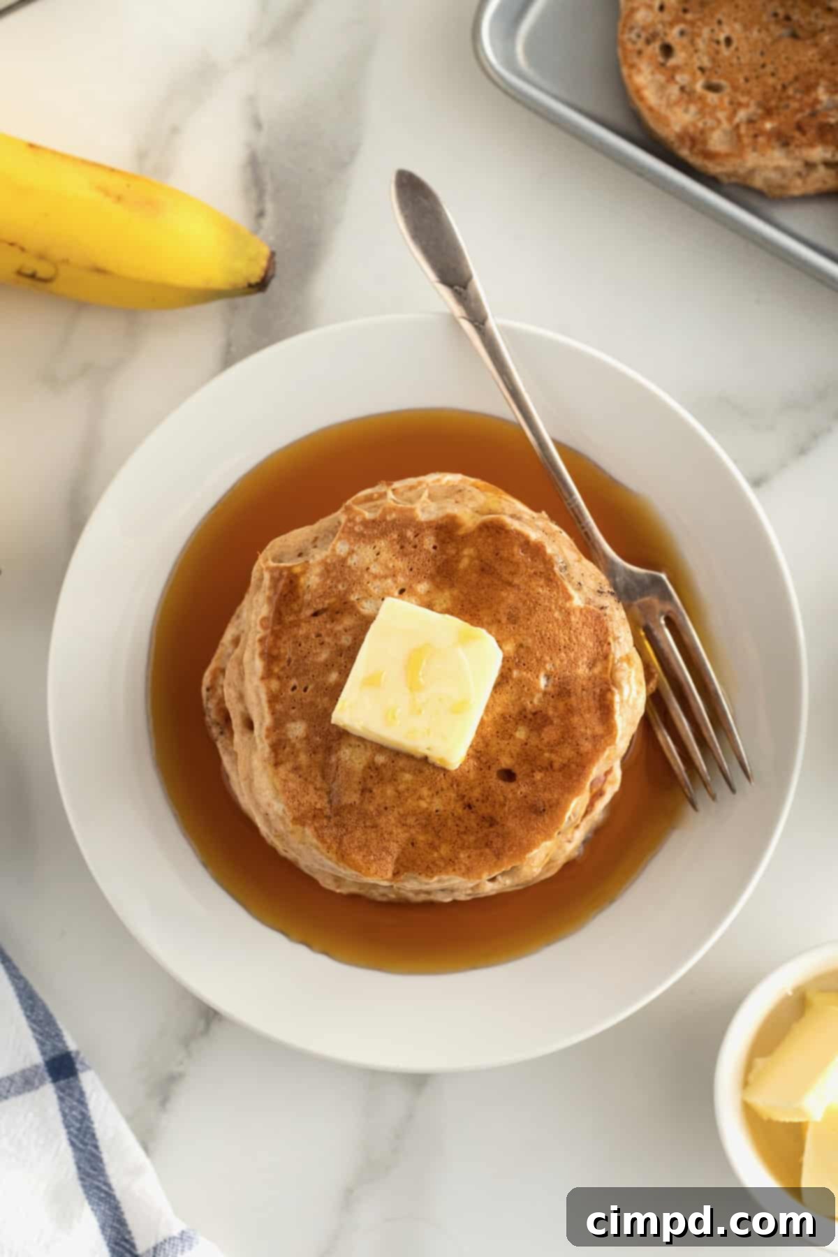 Close-up of a stack of Whole Wheat Banana Pancakes.
