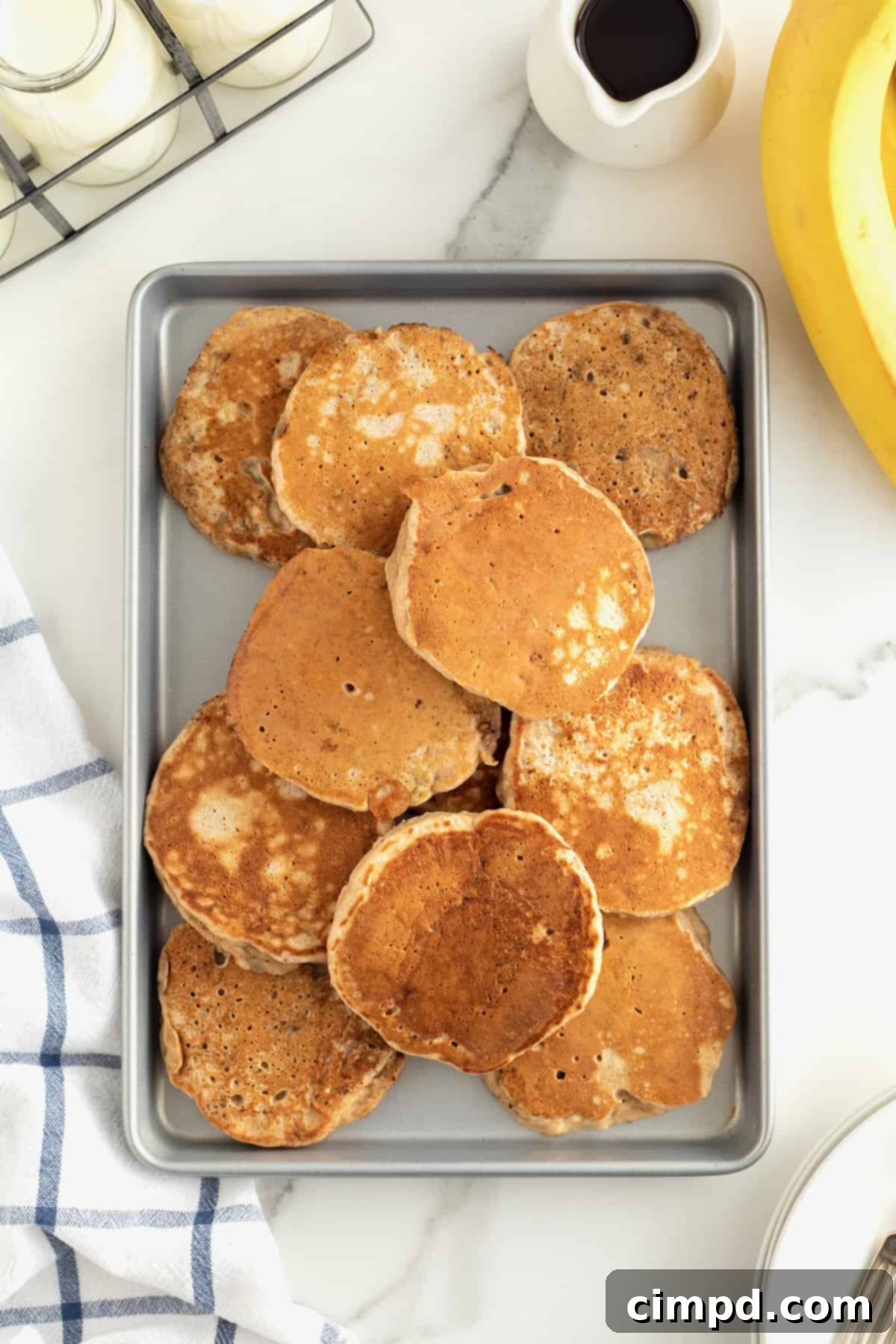 Cooked Whole Wheat Banana Pancakes being kept warm in an oven.
