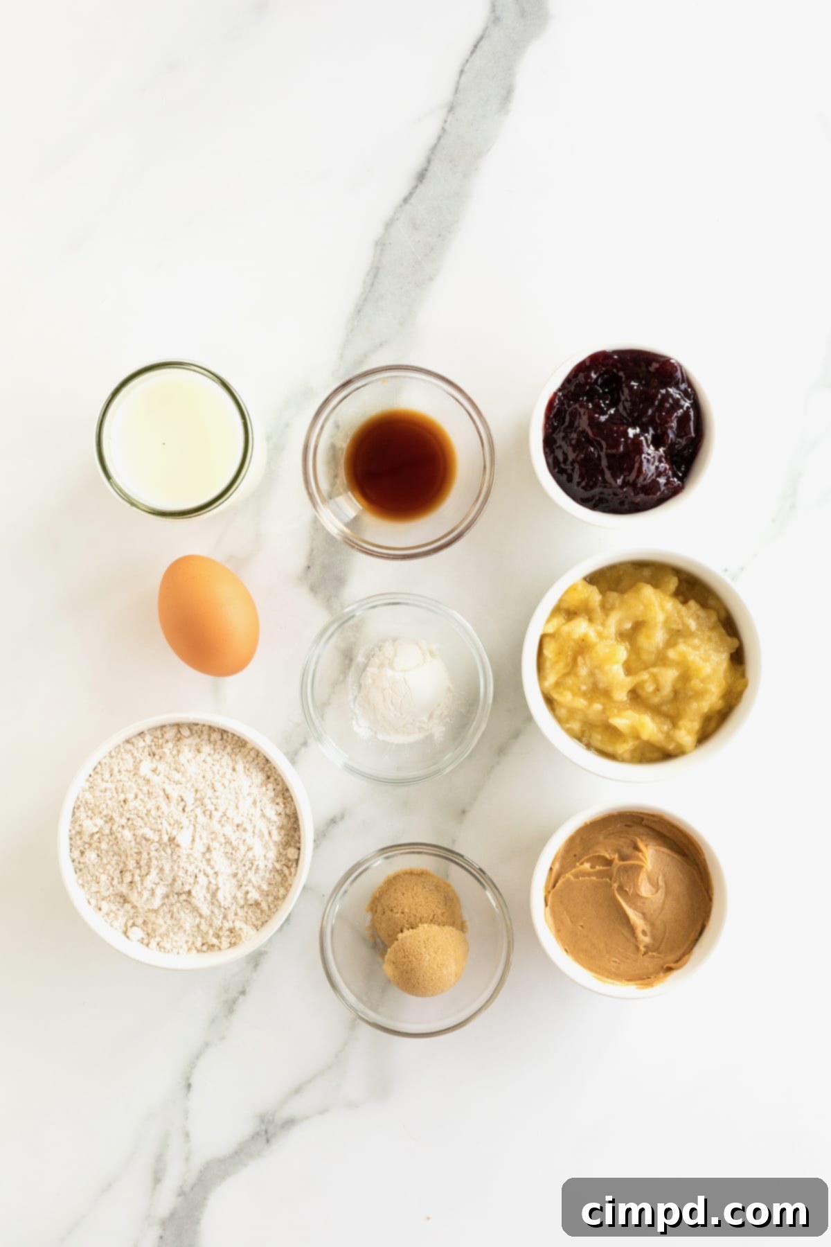 Ingredients for peanut butter and jelly sandwiches made with banana pancakes.