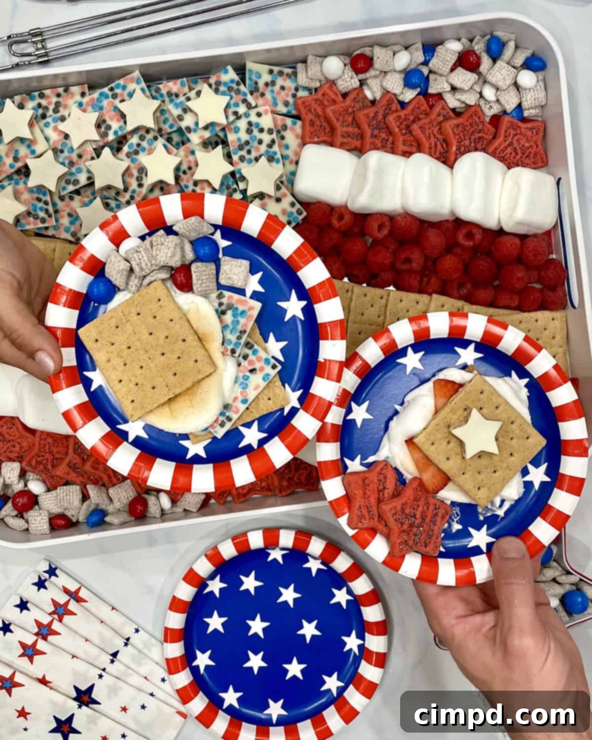 Patriotic Fourth of July S'mores Board 5 Delicious Fourth of July S'mores ready to eat, served on festive red, white and blue paper plates.