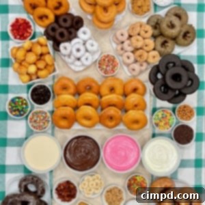 DIY Donut Decorating Bar 11 A variety of donuts, frosting, sprinkles and decorations.