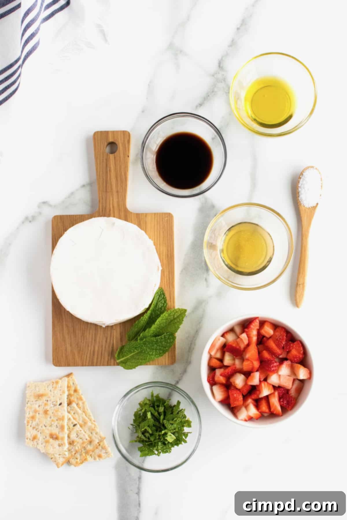 Ingredients for Grilled Brie with Strawberries laid out before preparation