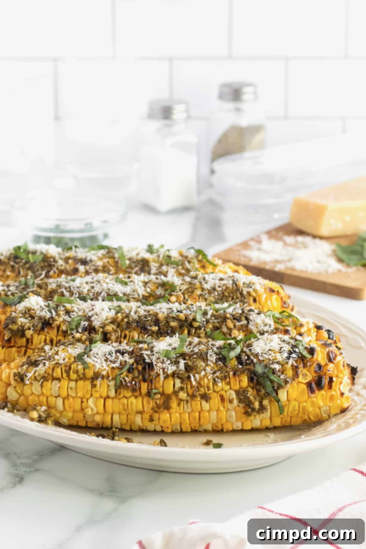 Grilled Corn with Pesto and Parmesan 5 A selection of delicious summer side dishes, including grilled corn by The BakerMama