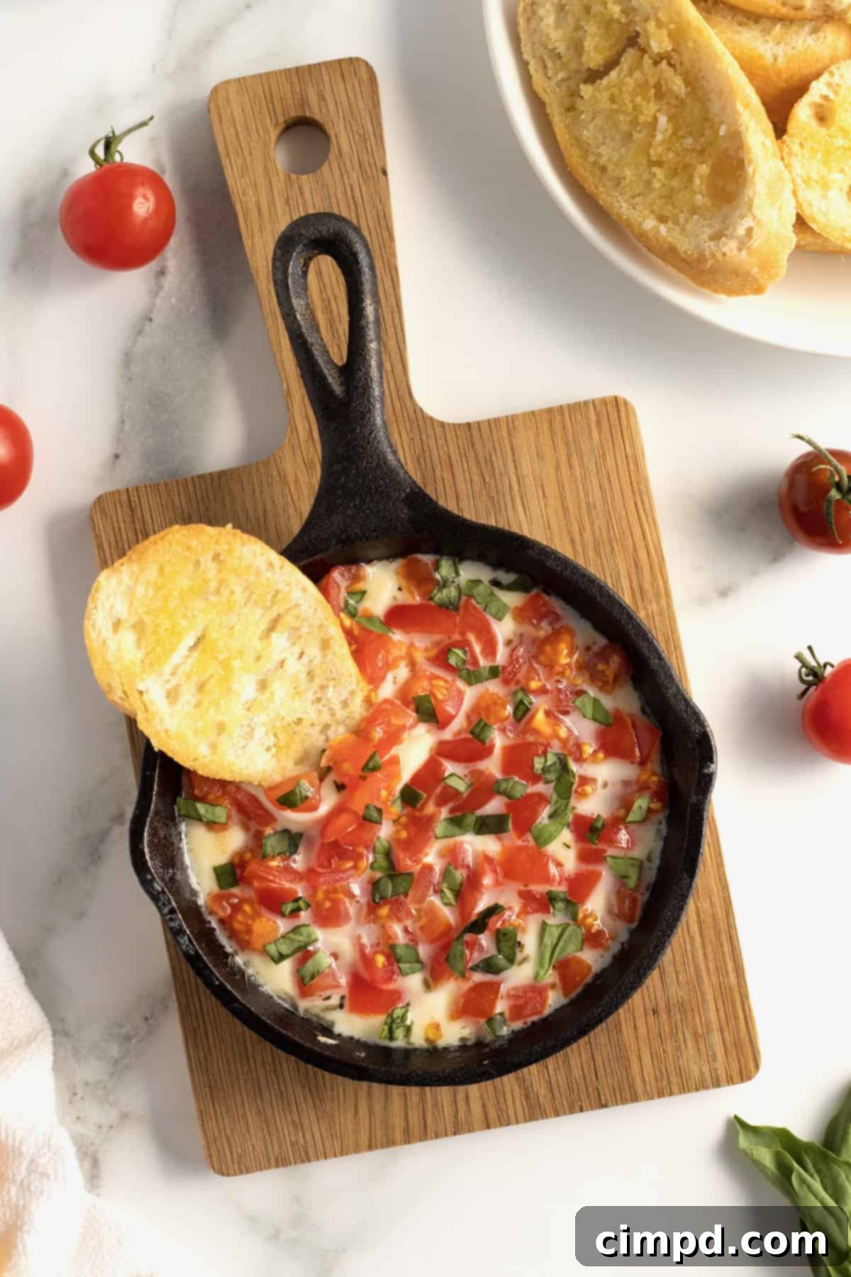 Bubbly Baked Caprese Dip 8 Skillet Caprese Dip served with toasted baguette slices