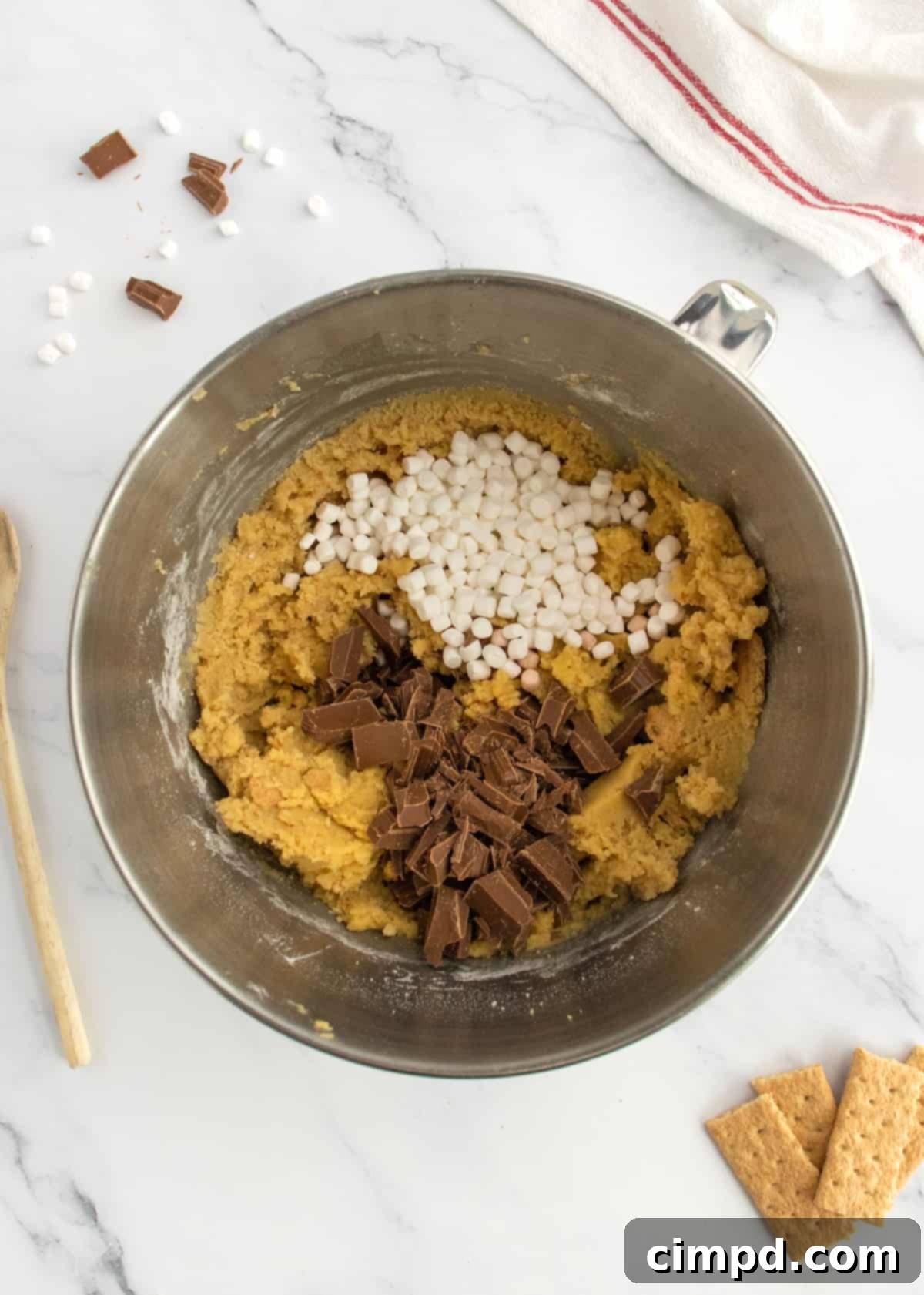 Dreamy Smores Pudding Cookies 6 Close-up of cookie dough with marshmallow bits and chocolate chunks folded in, ready for shaping.