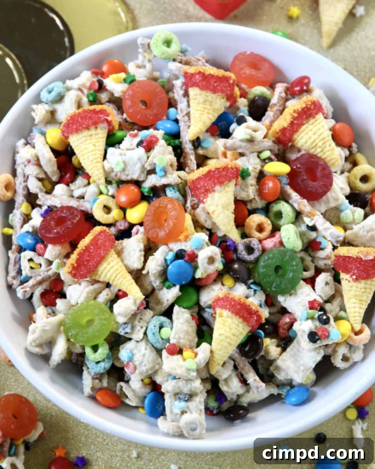 Hand grabbing a handful of Olympics Snack Mix from a bowl