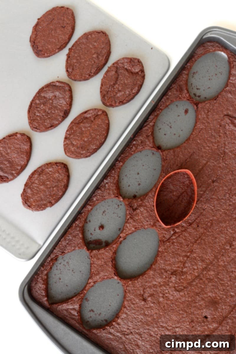 Pigskin Fudge Brownies 4 Cutting football shapes from a pan of brownies with a cookie cutter