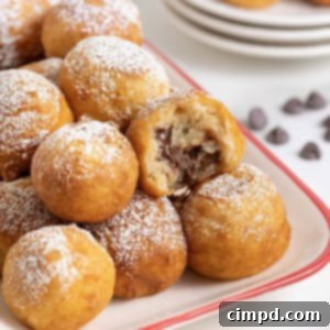A white ceramic serving tray with a red border filled with fried cookie dough.