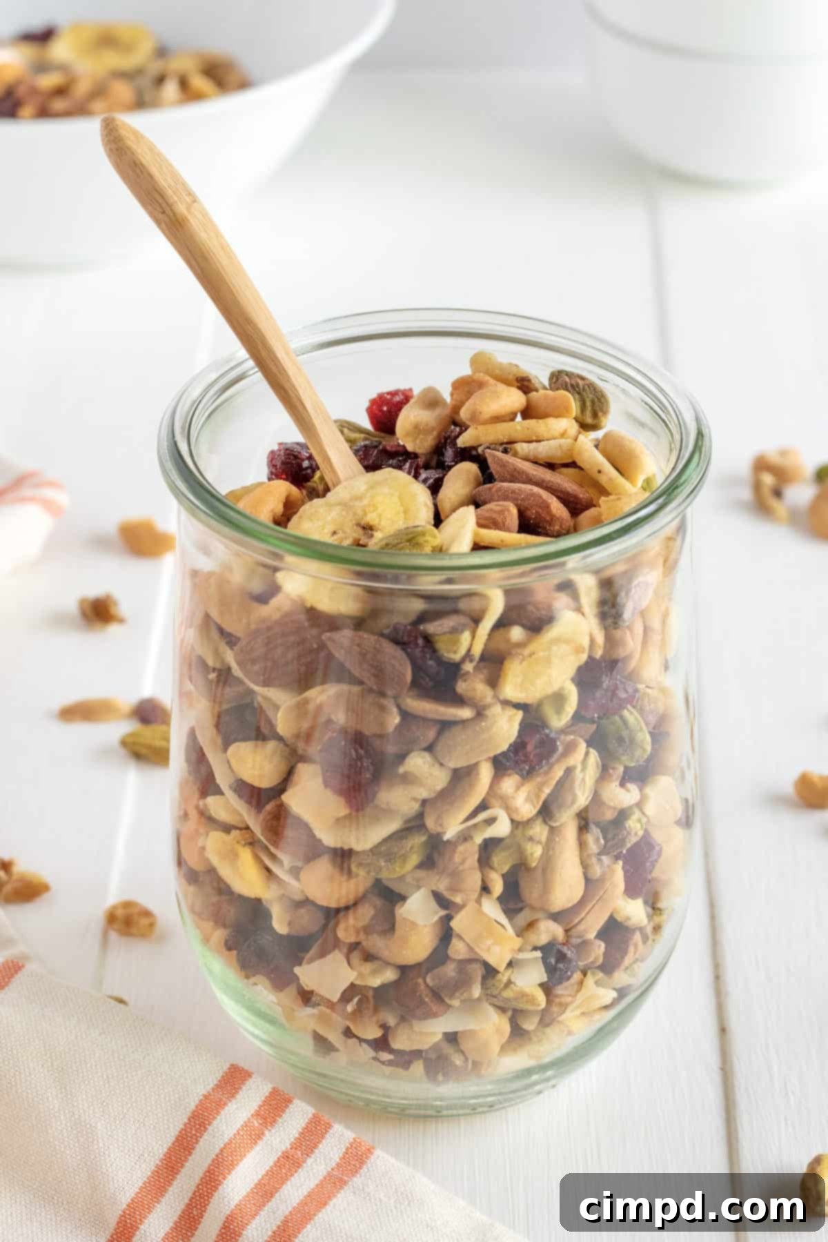 Close-up of a bowl of Healthy Weekend Trail Mix with various nuts and dried fruits