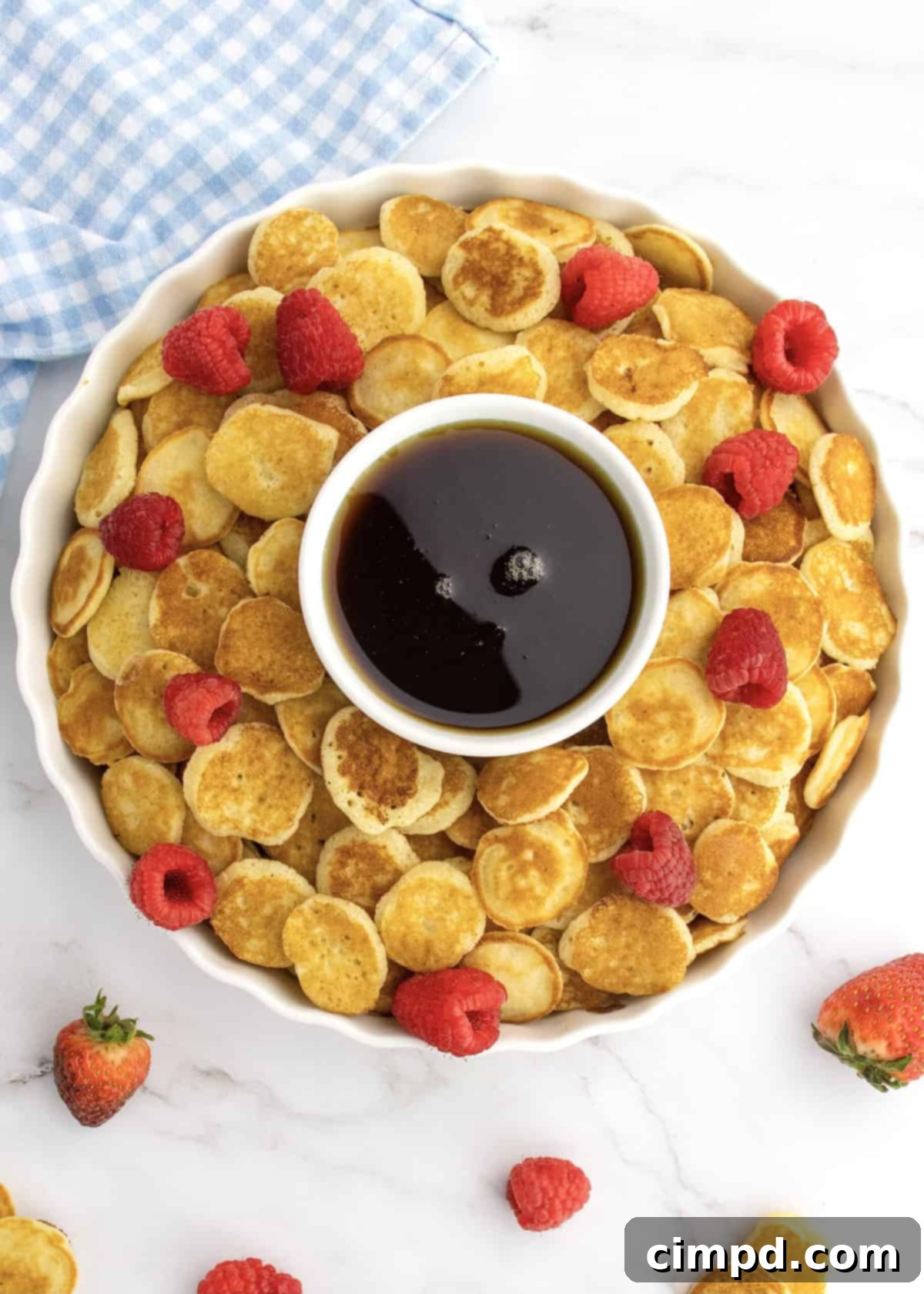 A delightful stack of Mini Pancakes, ready for dipping.