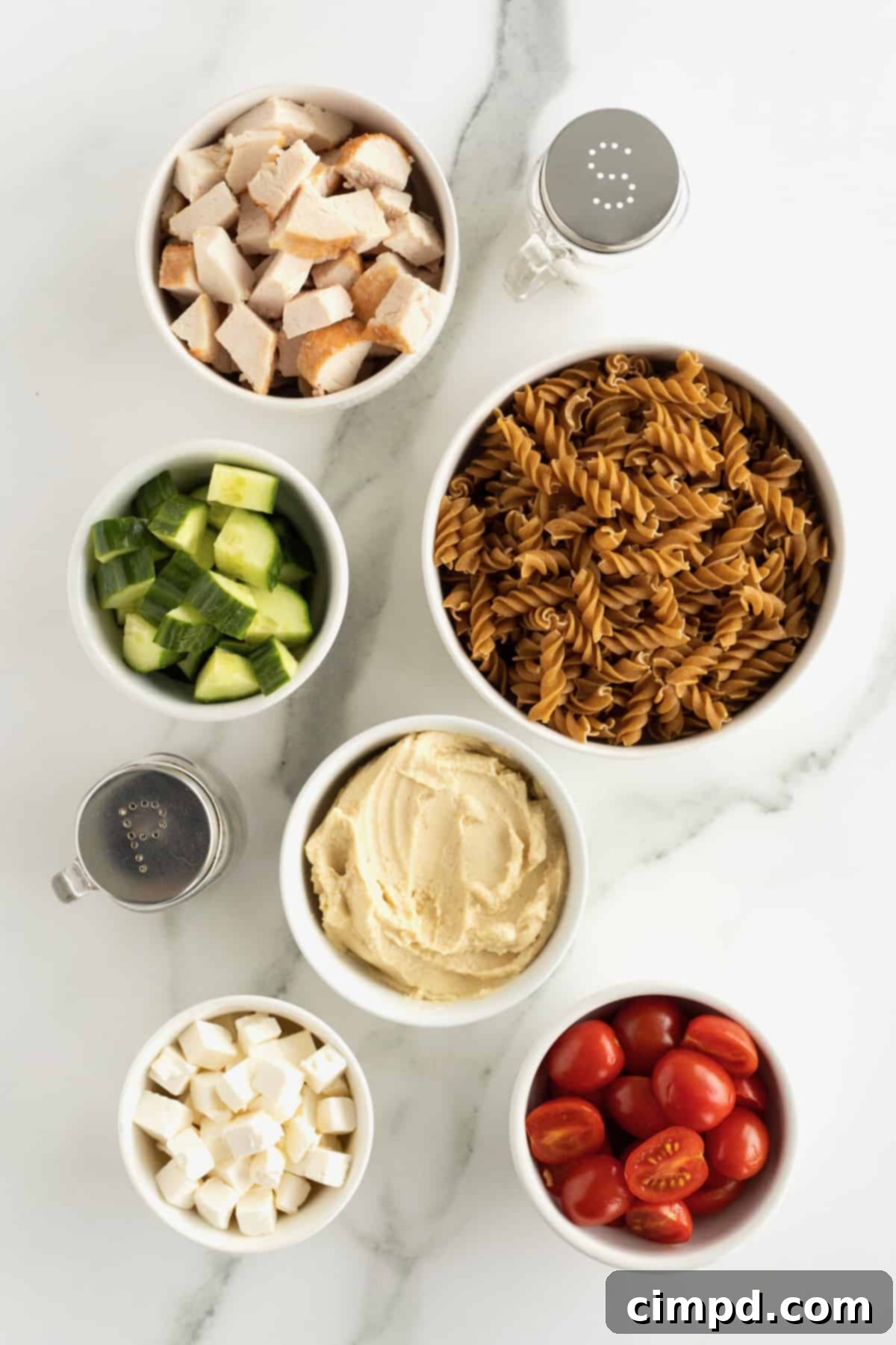 Bowl of fresh ingredients for Hummus Pasta Salad