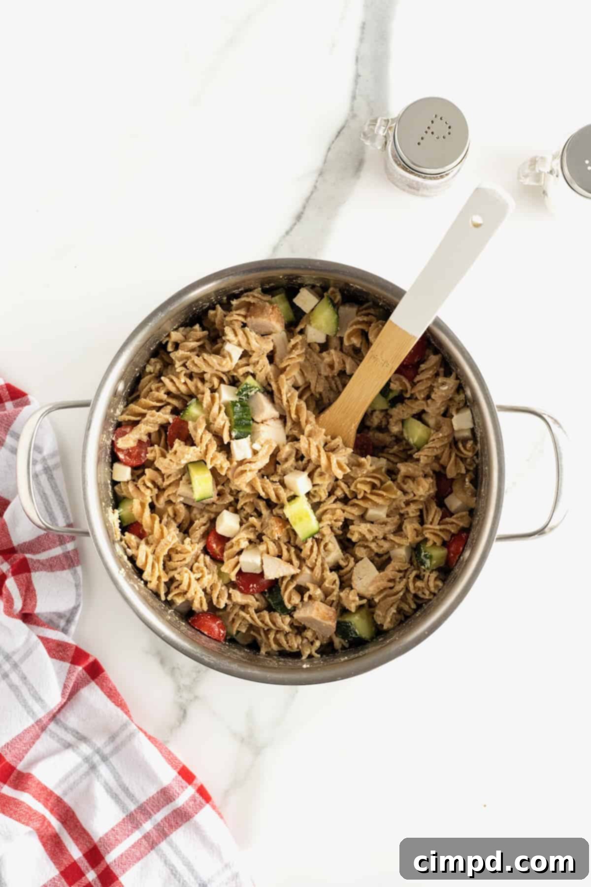 Hummus Pasta Salad in a clear container for meal prep