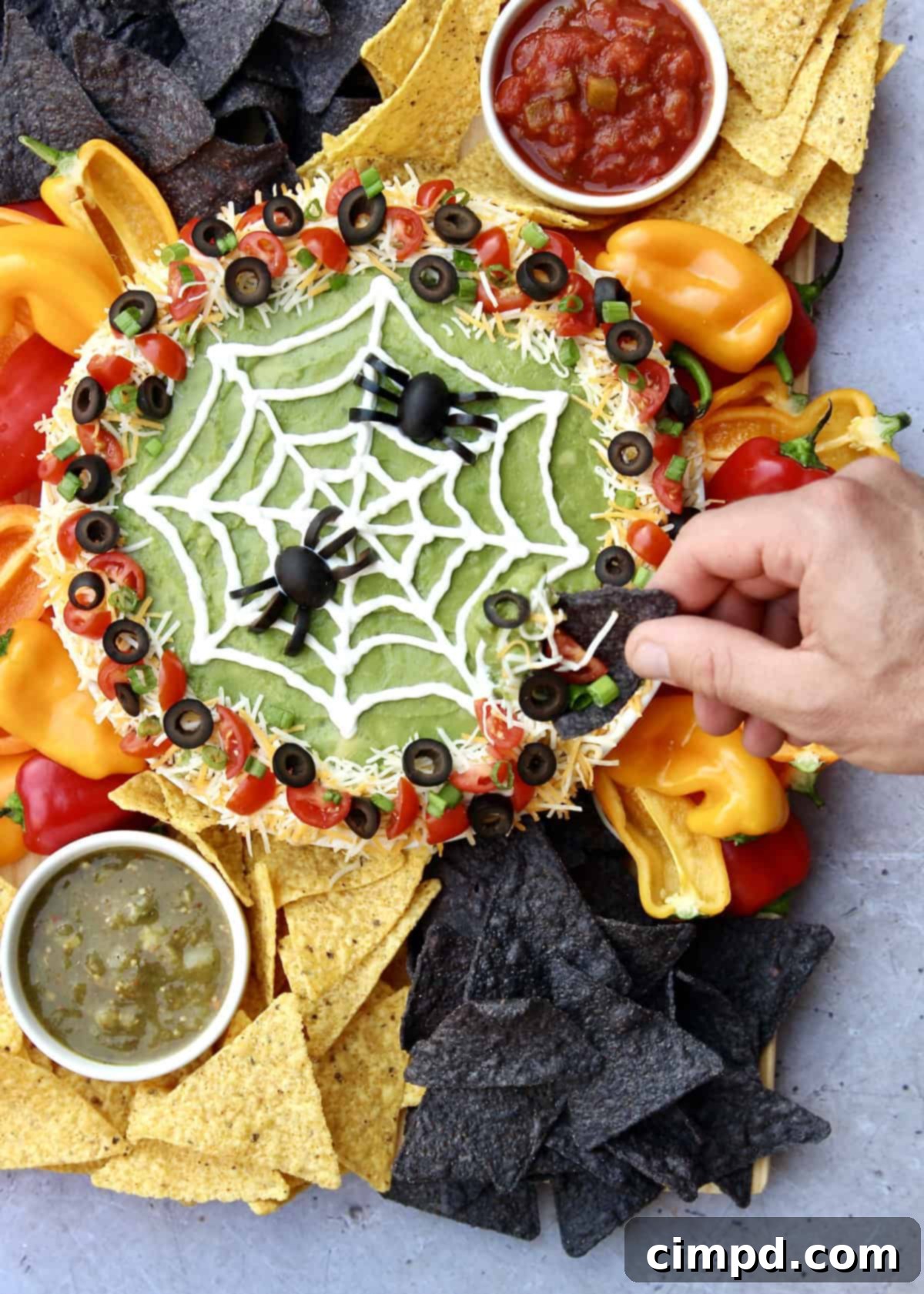 Spiderweb Seven Layer Dip by The BakerMama - An overhead shot of the full spiderweb seven-layer dip board.