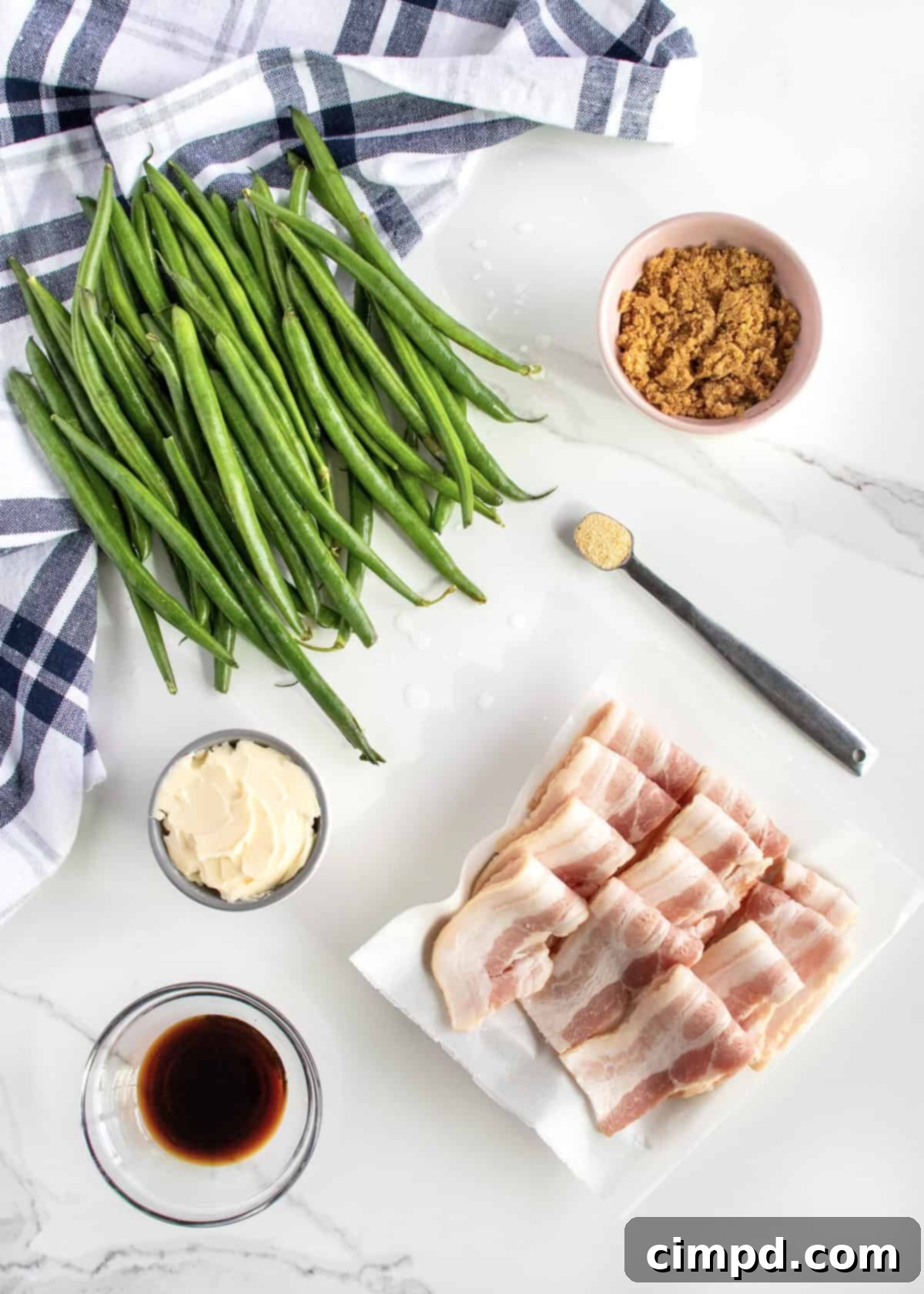 Fresh ingredients laid out for Green Bean Bundles preparation: green beans, bacon, butter, brown sugar, soy sauce, garlic salt.