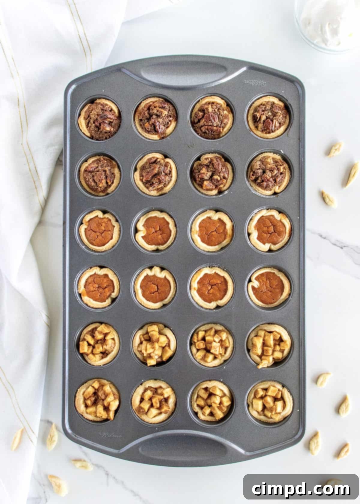 Easy One Pan Mini Thanksgiving Pie Trio 2 Assorted Mini Thanksgiving Pies: Pumpkin, Apple, and Pecan by The BakerMama