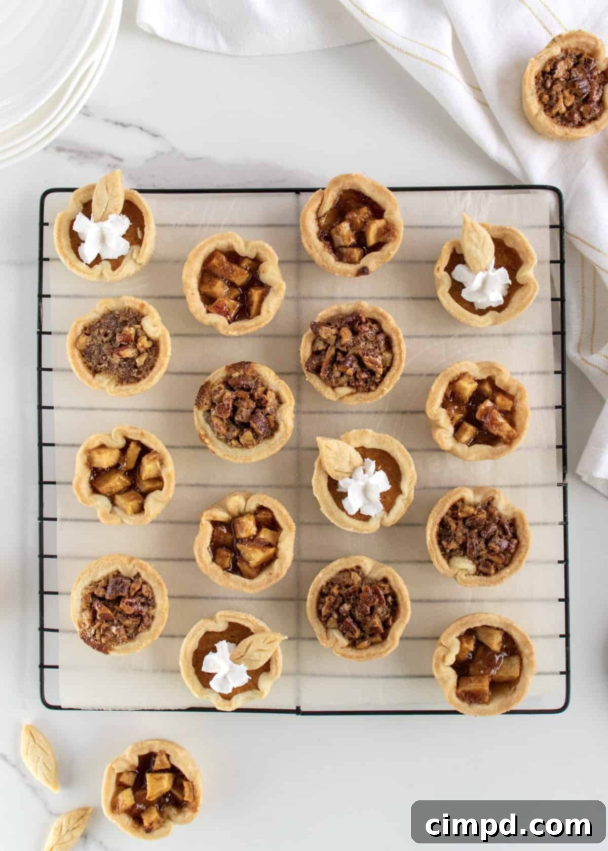 Easy One Pan Mini Thanksgiving Pie Trio 4 Ready-to-bake mini pie crusts in a muffin tin