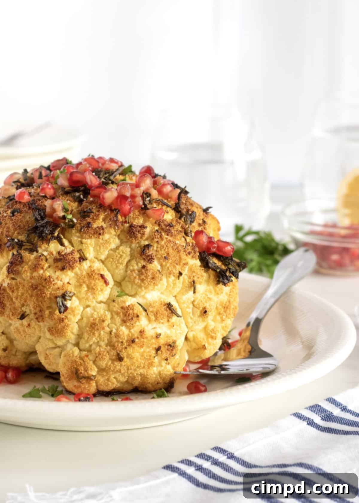 Close-up of the roasted cauliflower with pomegranate seeds, ready to be served.