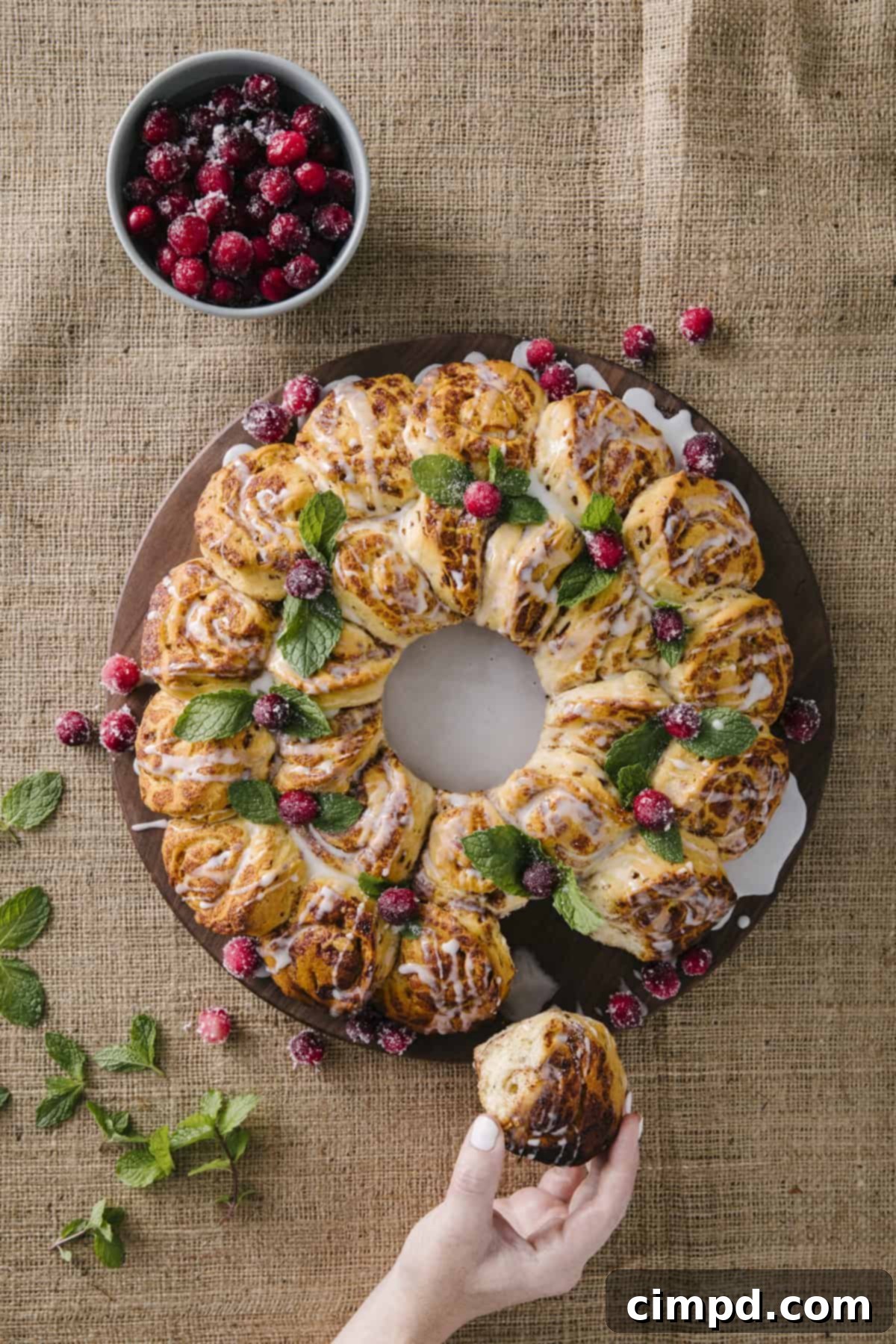 Close-up of sparkling sugared cranberries on a wire rack, drying before use as a holiday garnish.