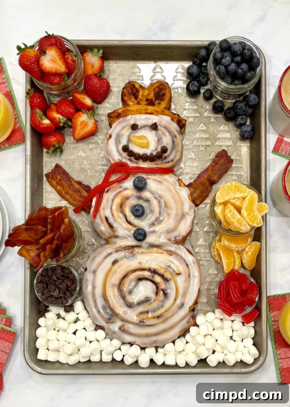 Cinnamon Roll Snowman Breakfast Tray with fresh fruit and bacon by The BakerMama