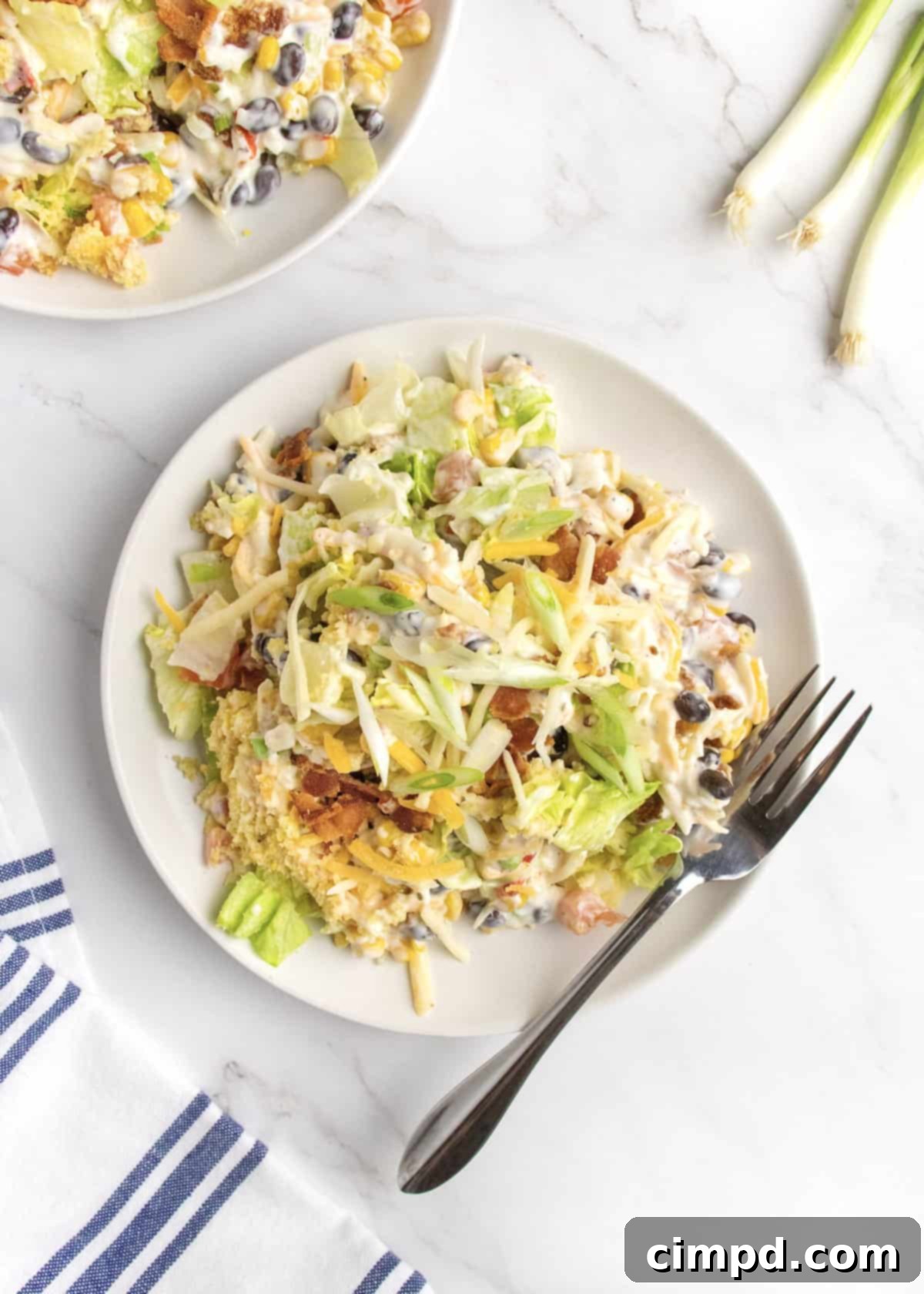 Southern Stacked Cornbread Medley 3 Close-up of the delicious layers of cornbread salad, highlighting the fresh ingredients.