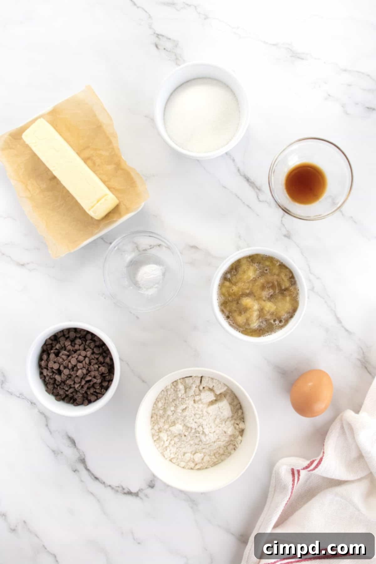 Mashed overripe bananas in a bowl, a key ingredient for moist Mini Banana Chocolate Chip Muffins.