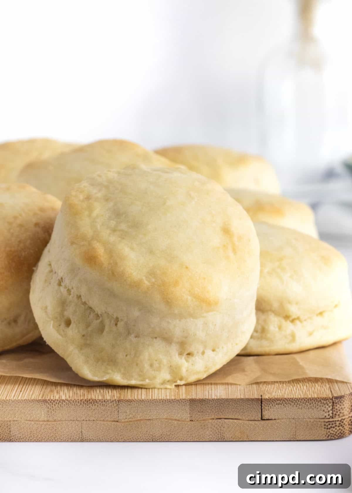 Heavenly Fluffy Biscuits 2 Homestyle Angel Biscuits, golden brown and perfectly risen, stacked on a cooling rack, ready to be enjoyed.