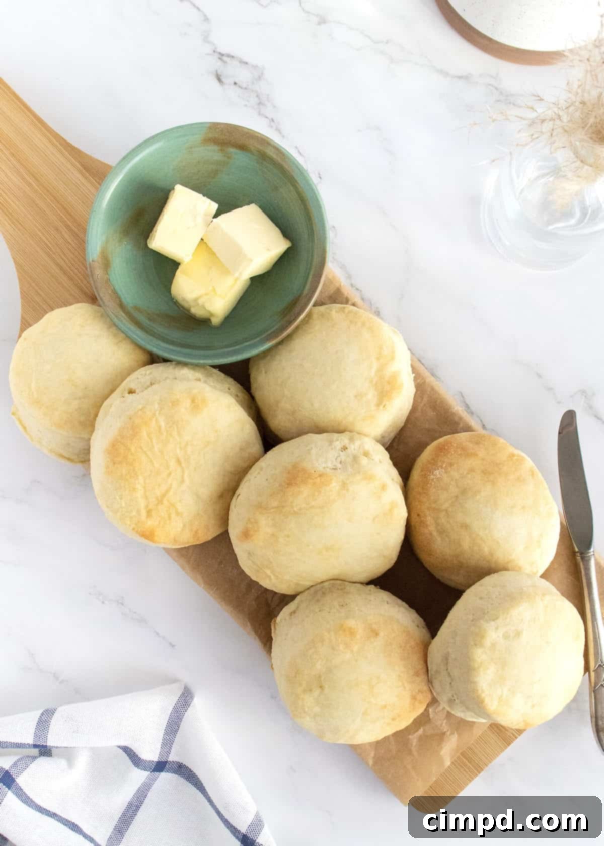Heavenly Fluffy Biscuits 7 A rustic woven basket brimming with freshly baked, golden-brown Angel Biscuits, invitingly ready for serving.