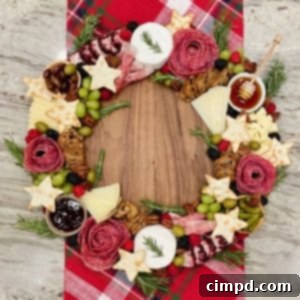 A charcuterie board designed to look like a holiday wreath.