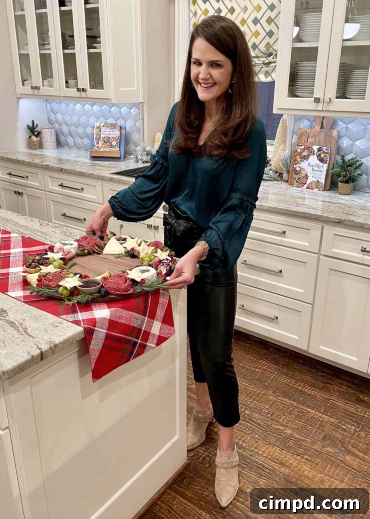Close-up shot of a Charcuterie Wreath Board, showcasing an assortment of cheeses, cured meats, fresh fruits, and savory accompaniments arranged in a circular design.