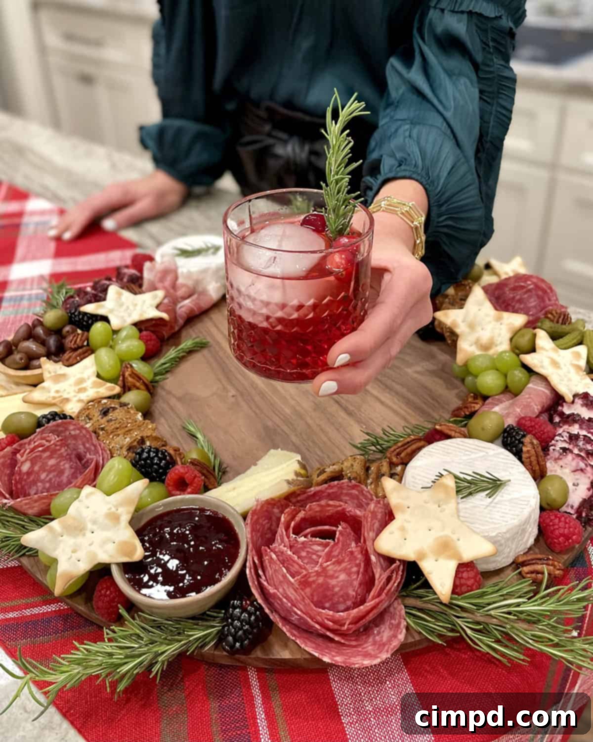 A vibrant Charcuterie Wreath Board featuring salami roses, star crackers, various cheeses, and fresh produce, ready for holiday serving.