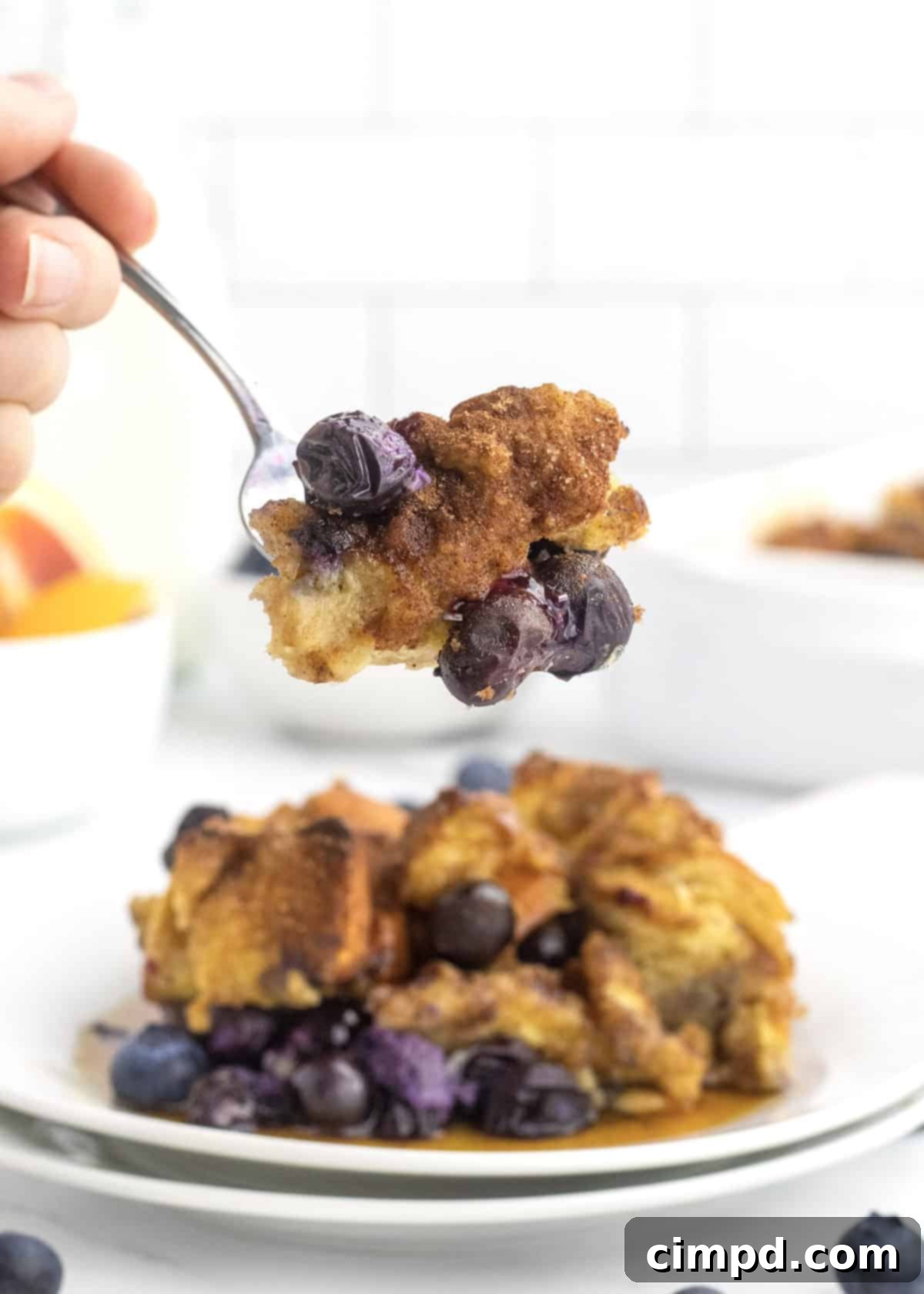 Close-up of Blueberry French Toast Casserole, showing moist interior and blueberries.