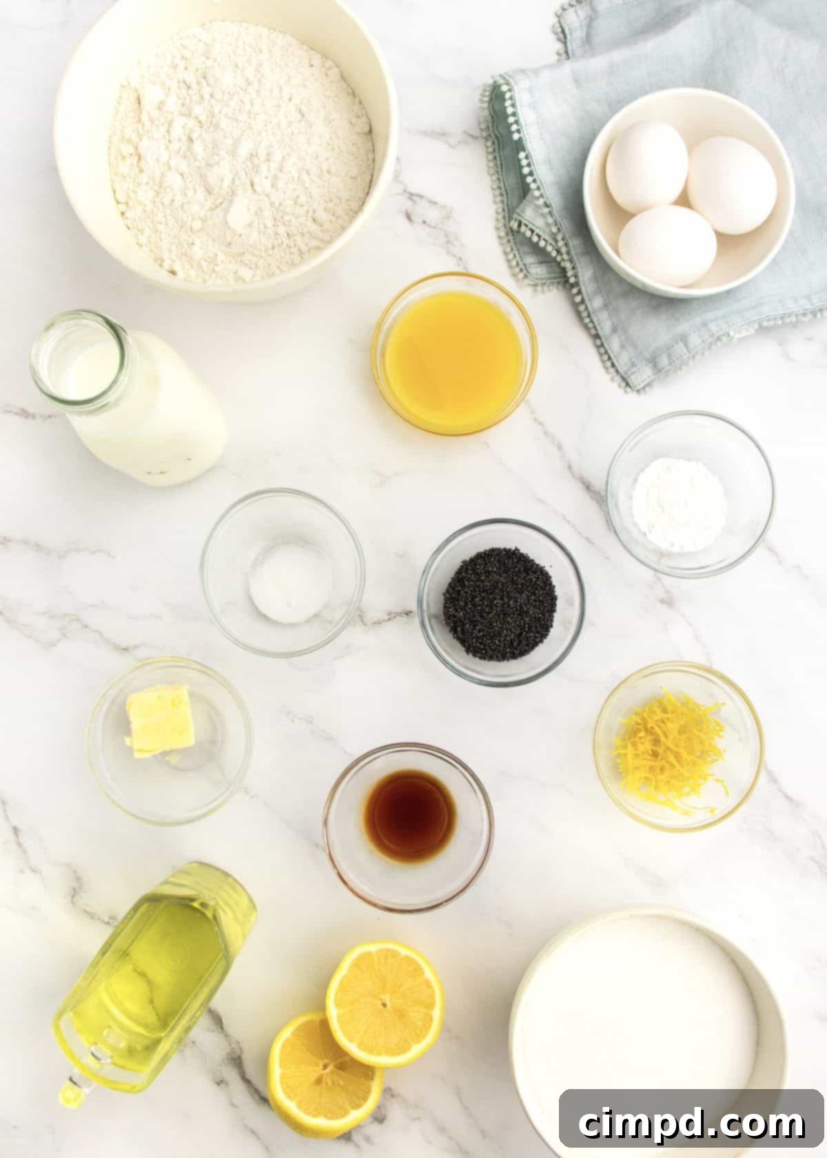 Lemon Poppy Seed Bread resting on a cooling rack, freshly glazed, by The BakerMama