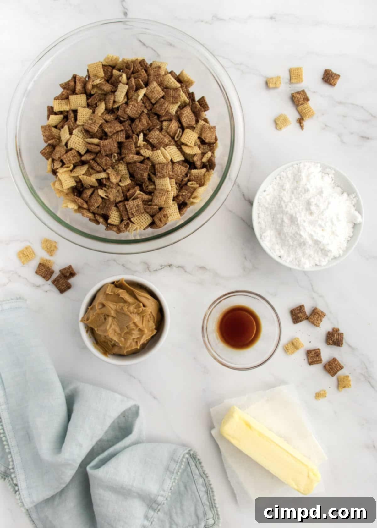 Sweet Dust Squares 4 Bowl of Muddy Buddy Bites with a delicate dusting of powdered sugar