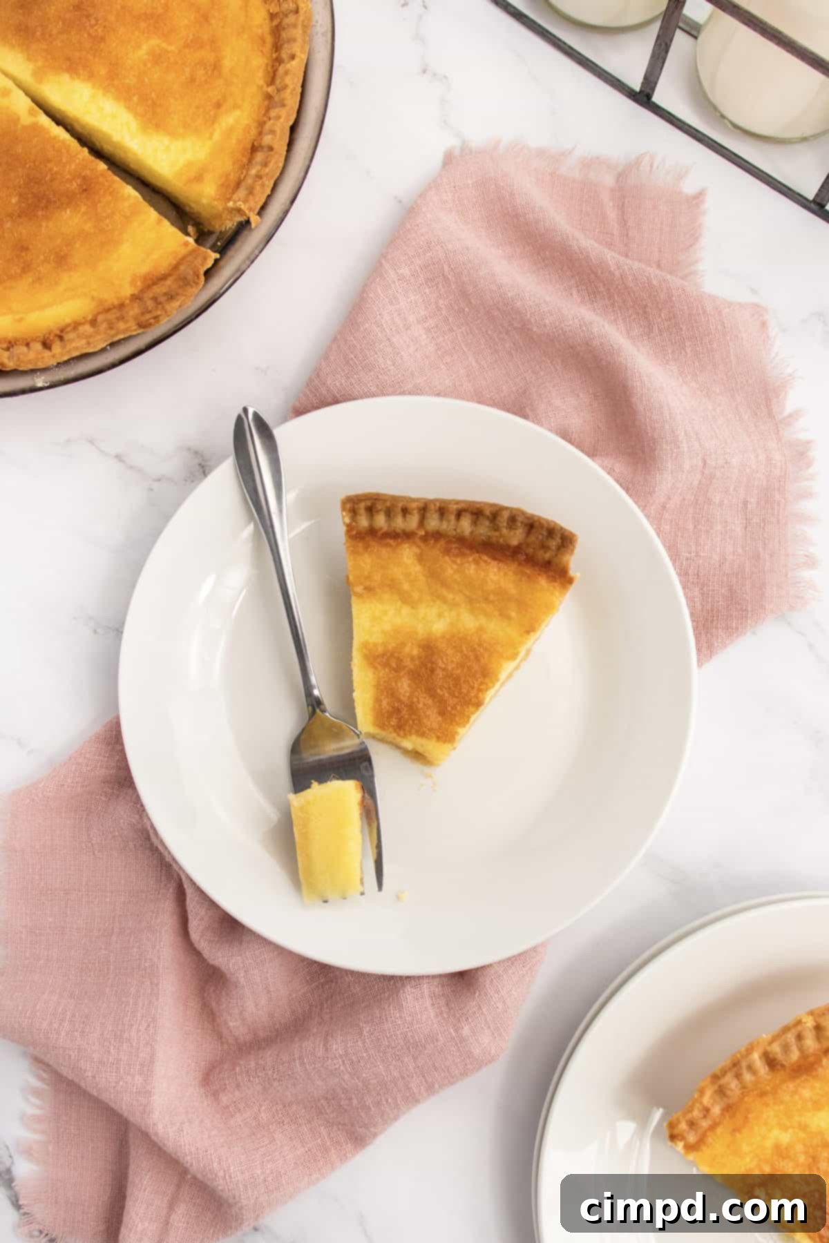 Velvet Buttermilk Bliss 3 Close-up of a slice of Buttermilk Pie showcasing its creamy texture by The BakerMama