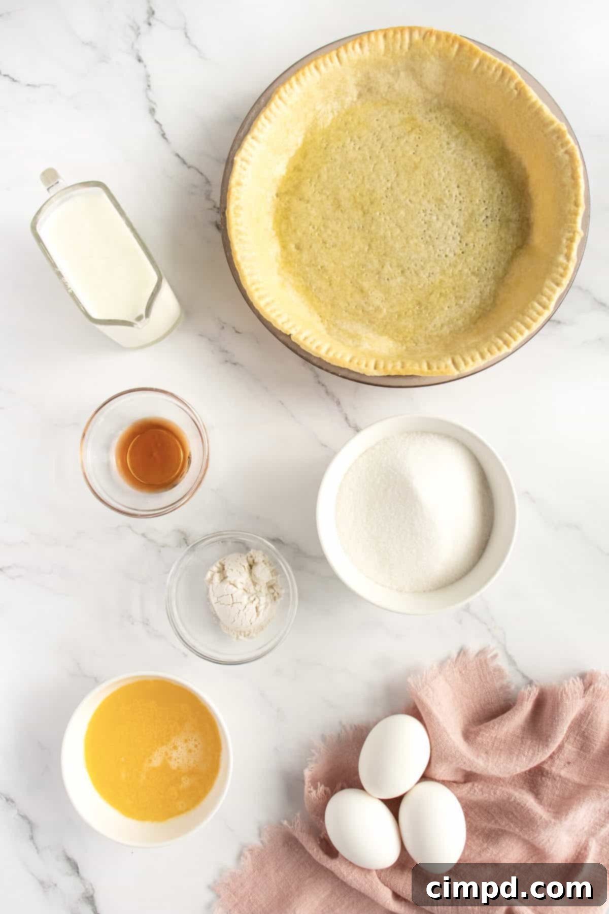 Velvet Buttermilk Bliss 4 Buttermilk Pie cooling on a wire rack, ready to be served by The BakerMama