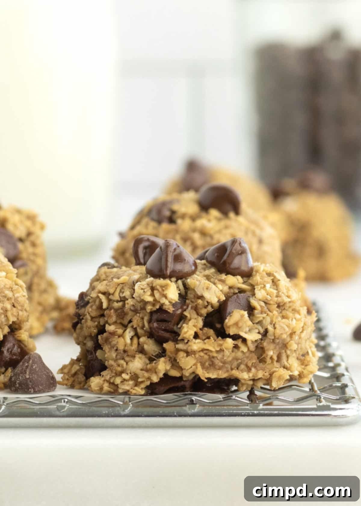 Prepared dough balls of 4-Ingredient Steel Cut Oat Cookies on a baking sheet