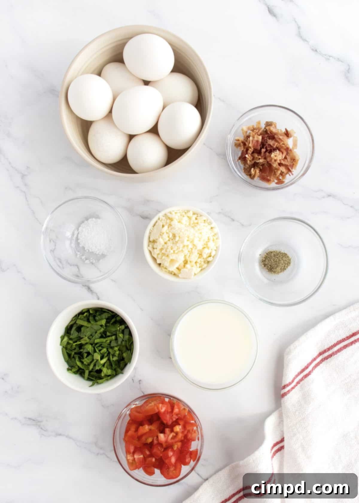 Savory Bacon, Spinach and Tomato Egg Bites 4 Ingredients for Bacon Spinach and Tomato Egg Bites laid out on a counter
