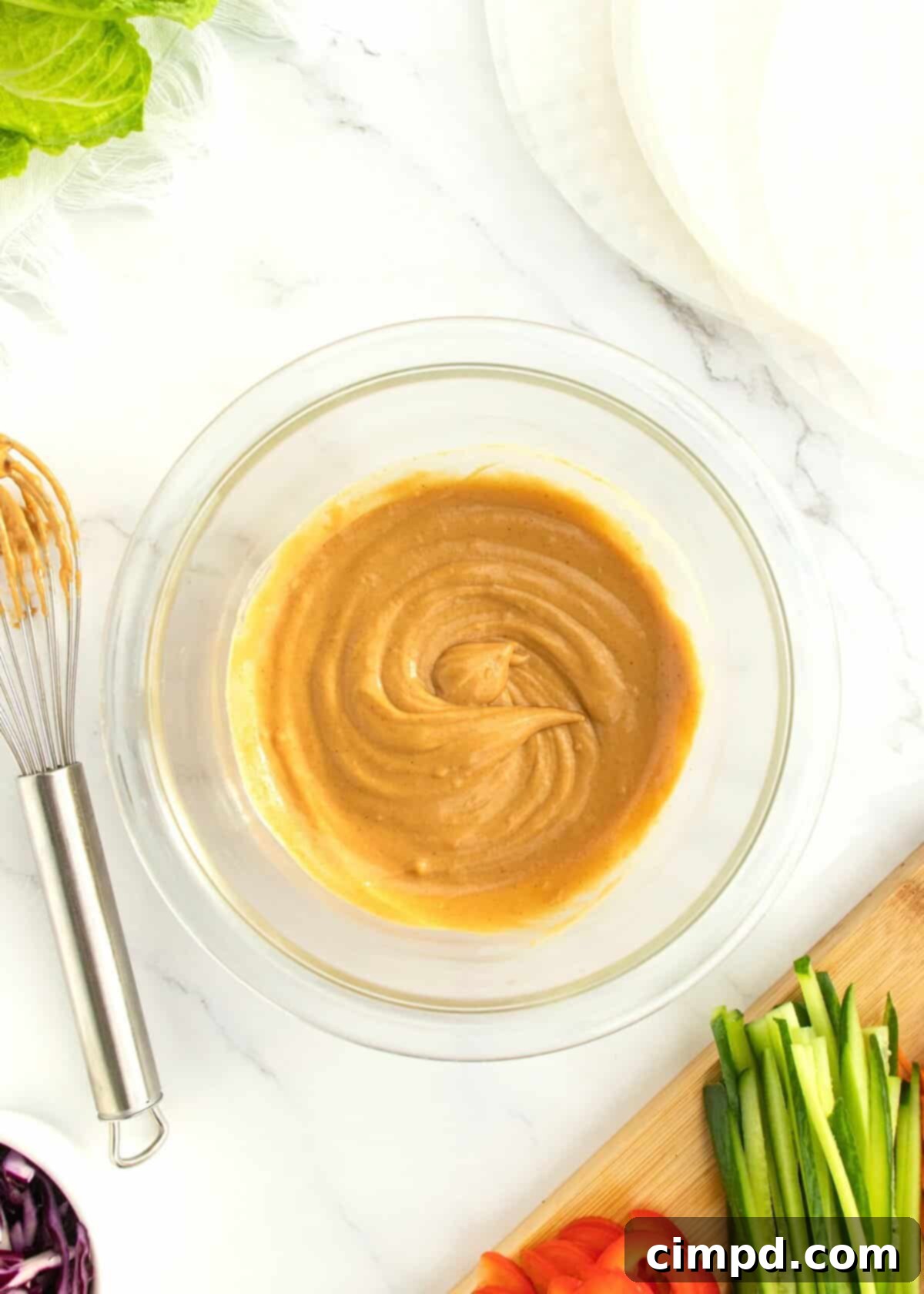 Refreshing Summer Wraps 6 A small bowl of homemade peanut dipping sauce, ready to be served with summer rolls.