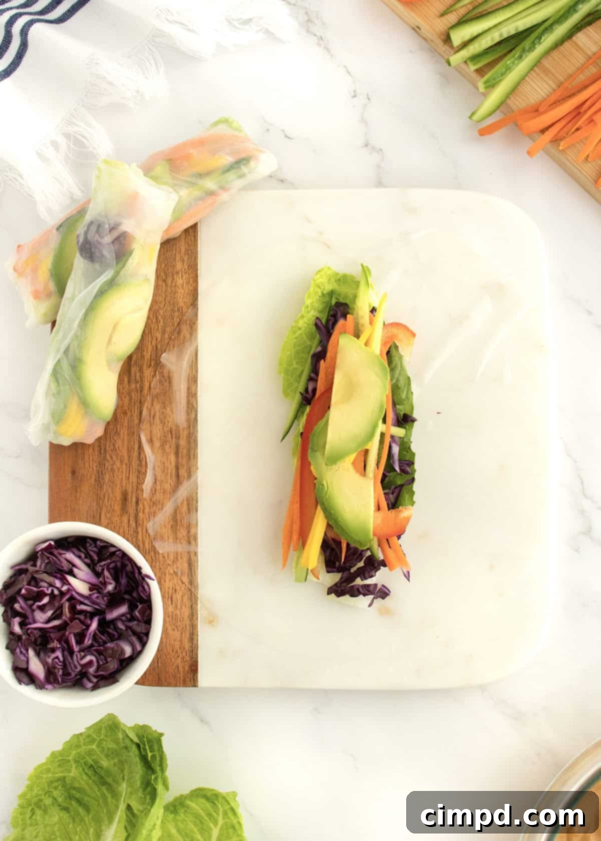Refreshing Summer Wraps 7 Step-by-step image of assembling a summer roll, showing the ingredients laid out on the rice paper.