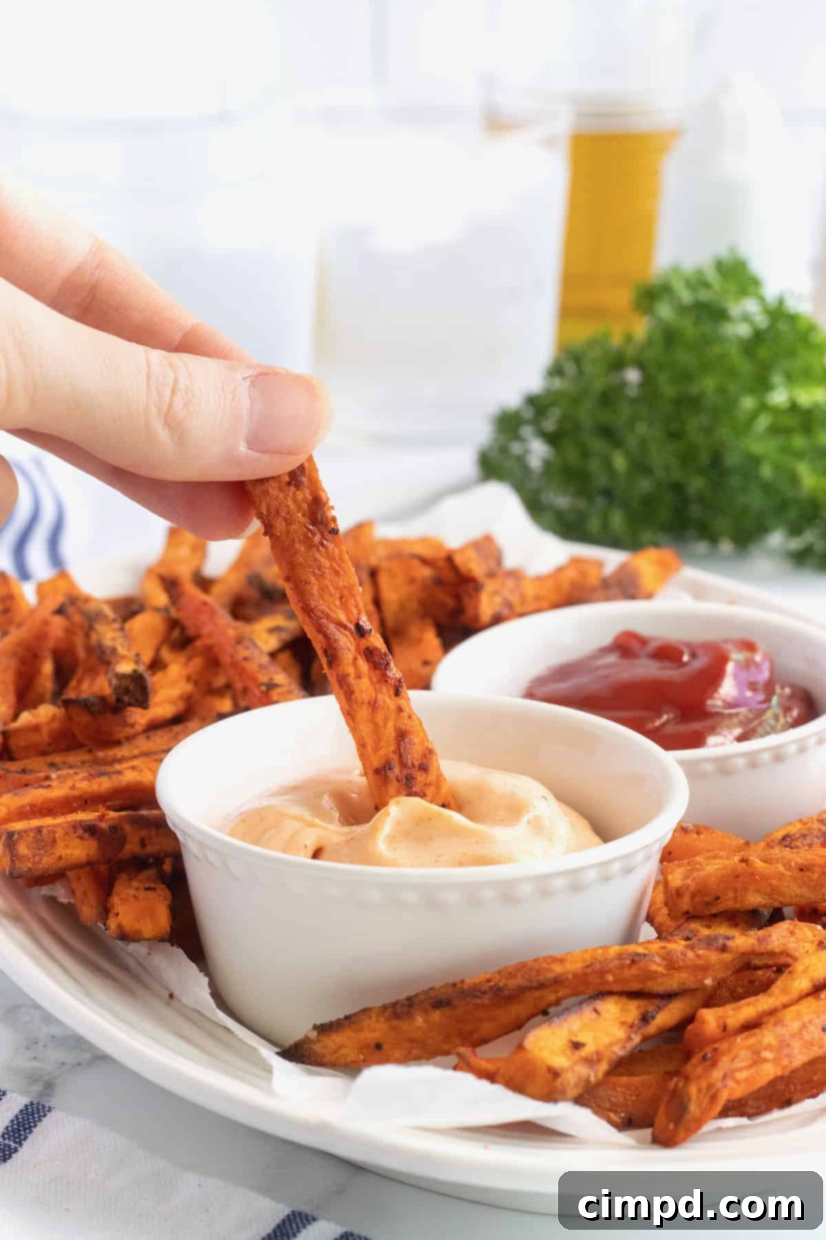 Close-up of baked sweet potato fries with a rich, golden color