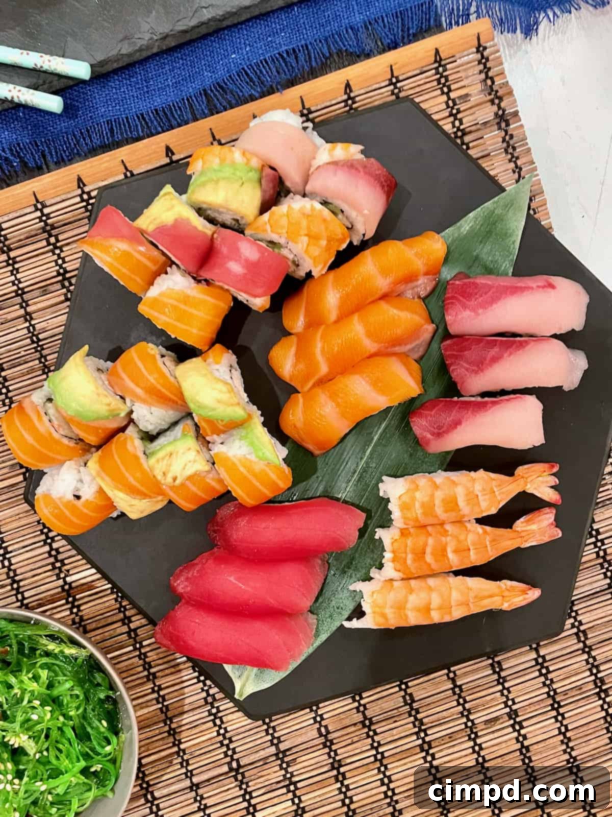 Sushi & Sangria: A Delicious Duet 3 A vibrant spread featuring a variety of sushi, spring rolls, edamame, and other Japanese appetizers, arranged beautifully on a table.